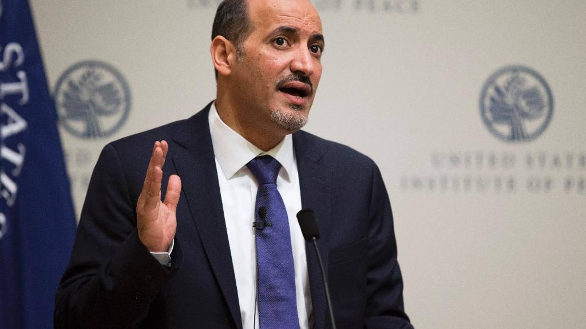 President Ahmad al-Jarba, president of the National Coalition for Syrian Revolutionary and Opposition Forces, speaks at the U.S. Institute of Peace, on Wednesday, May 7, 2014, in Washington. Al-Jarba said that rebel forces need weapons that could “neutralize’’ aerial raids by President Bashar Assad’s air force in order to change the balance of power on the ground and pave the way for a political solution to the crisis. (AP Photo/ Evan Vucci)