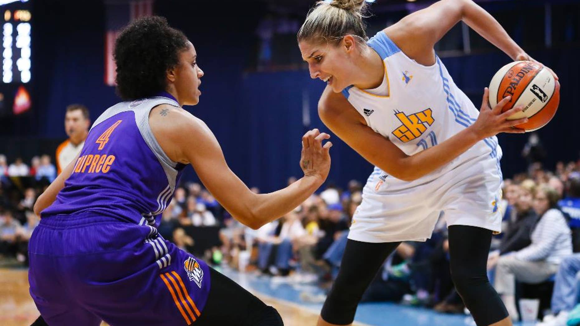 FILE- In this Sept. 12, 2014, file photo, Chicago Sky forward Elena Delle Donne (11) works the ball against Phoenix Mercury forward Candice Dupree (4) during the second half of Game 3 of the WNBA Finals basketball series in Chicago. Delle Donne became the latest post player to withdraw from the U.S. women's basketball team because of injury. (AP Photo/Kamil Krzaczynski, File)