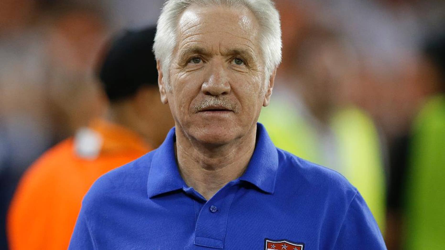 In this Sept. 3, 2013, photo, U.S. women's national soccer team coach Tom Sermanni waits for an international friendly against Mexico in Washington. U.S. Soccer says Sermanni has been fired as coach. The Americans beat China 2-0 in an exhibition game Sunday, April 6, 2014, in Commerce City, Colo. Hours later, the U.S. soccer announced the move in a news release. (AP Photo/Alex Brandon)