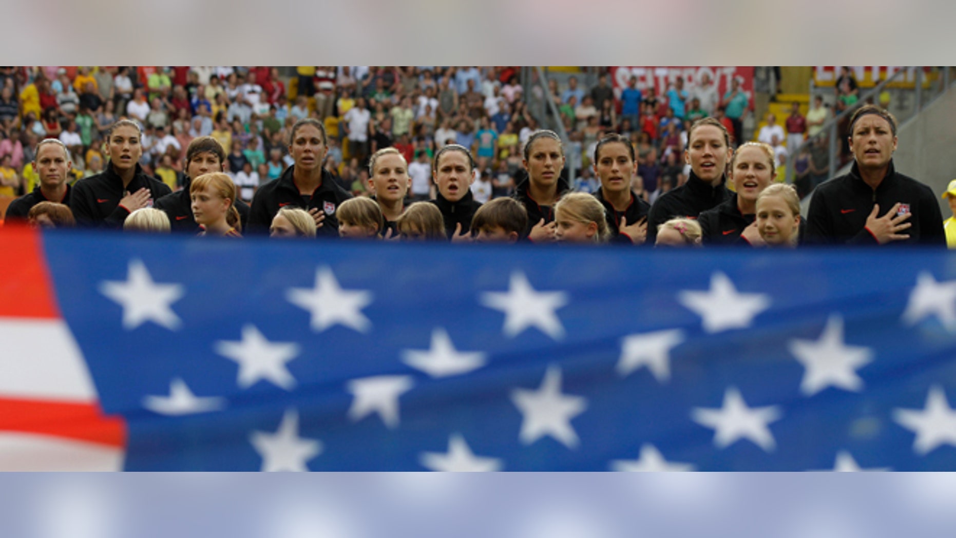US players sing the nationa anthem prior to the quarterfinal match between Brazil and the United States at the Womens Soccer World Cup in Dresden, Germany, Sunday, July 10, 2011. (AP Photo/Marcio Jose Sanchez)