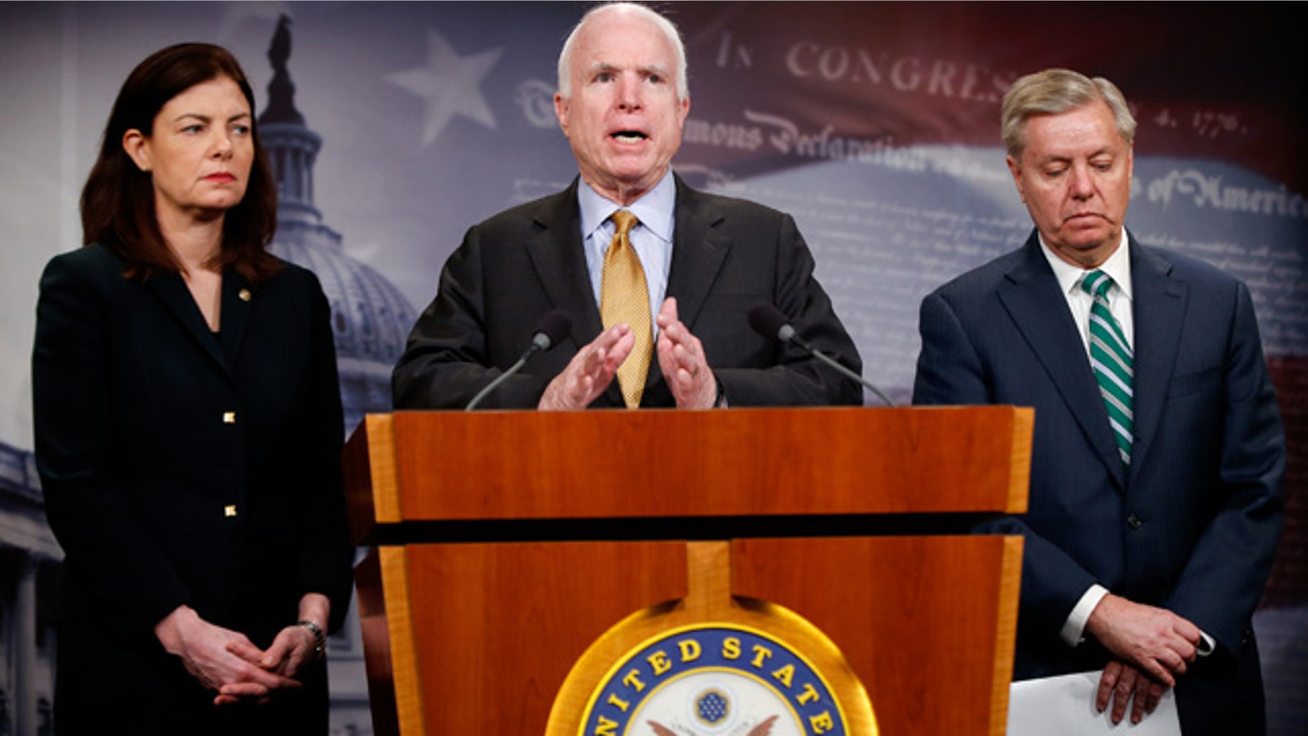 March 26, 2015: Senate Armed Service Committee Chairman Sen. John McCain, R-Ariz., center, accompanied by fellow committee members, Sen. Kelly Ayotte, R-N.H., left, and Sen. Lindsey Graham, R-S.C., speaks during a news conference on Capitol Hill in Washington to talk about the situation in Yemen. (AP Photo/Andrew Harnik)
