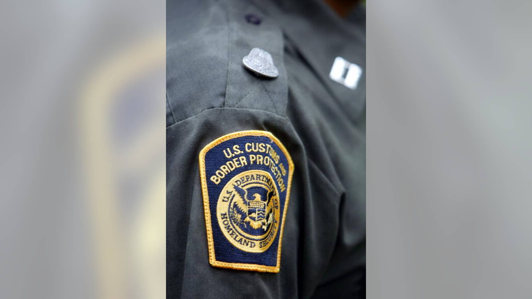 An agent wears the new U.S. Customs and Border Protection patch on his sleeve April 24, 2004 in Aguadilla, Puerto Rico.