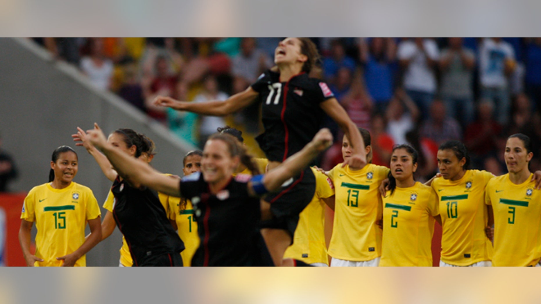 US players celebrate after winning in a penalty shootout the quarterfinal match between Brazil and the United States at the Womens Soccer World Cup in Dresden, Germany, Sunday, July 10, 2011. (AP Photo/Petr David Josek)