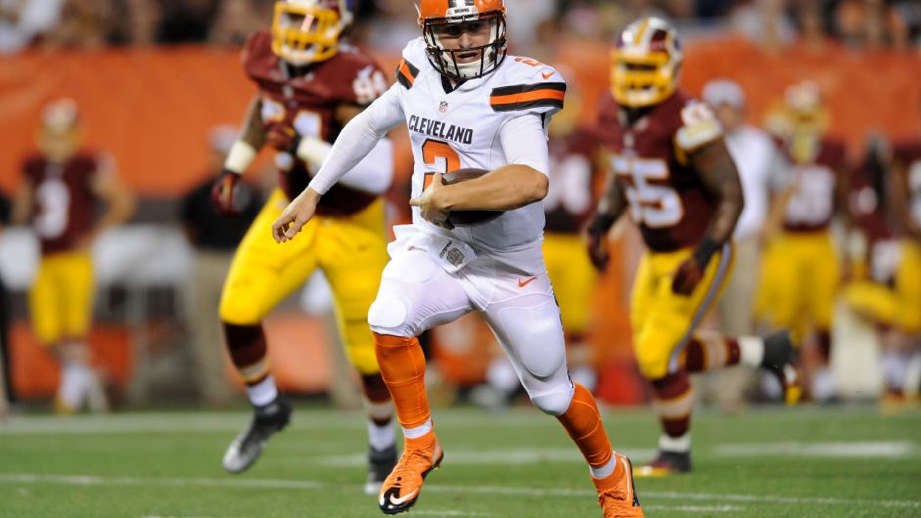 Aug 13, 2015; Cleveland, OH, USA; Cleveland Browns quarterback Johnny Manziel (2) runs for a touchdown during the second quarter against the Washington Redskins in a preseason NFL football game at FirstEnergy Stadium. Mandatory Credit: Ken Blaze-USA TODAY Sports