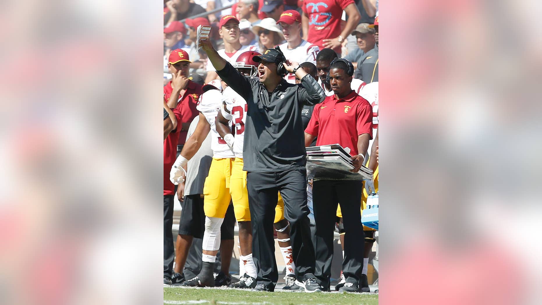 Southern California head coach Steve Sarkisian argues a referees call during the second half against Stanford in a NCAA college football game on Saturday, Sept. 6, 2014, in Stanford, Calif. Southern California won 13-10. (AP Photo/Tony Avelar)