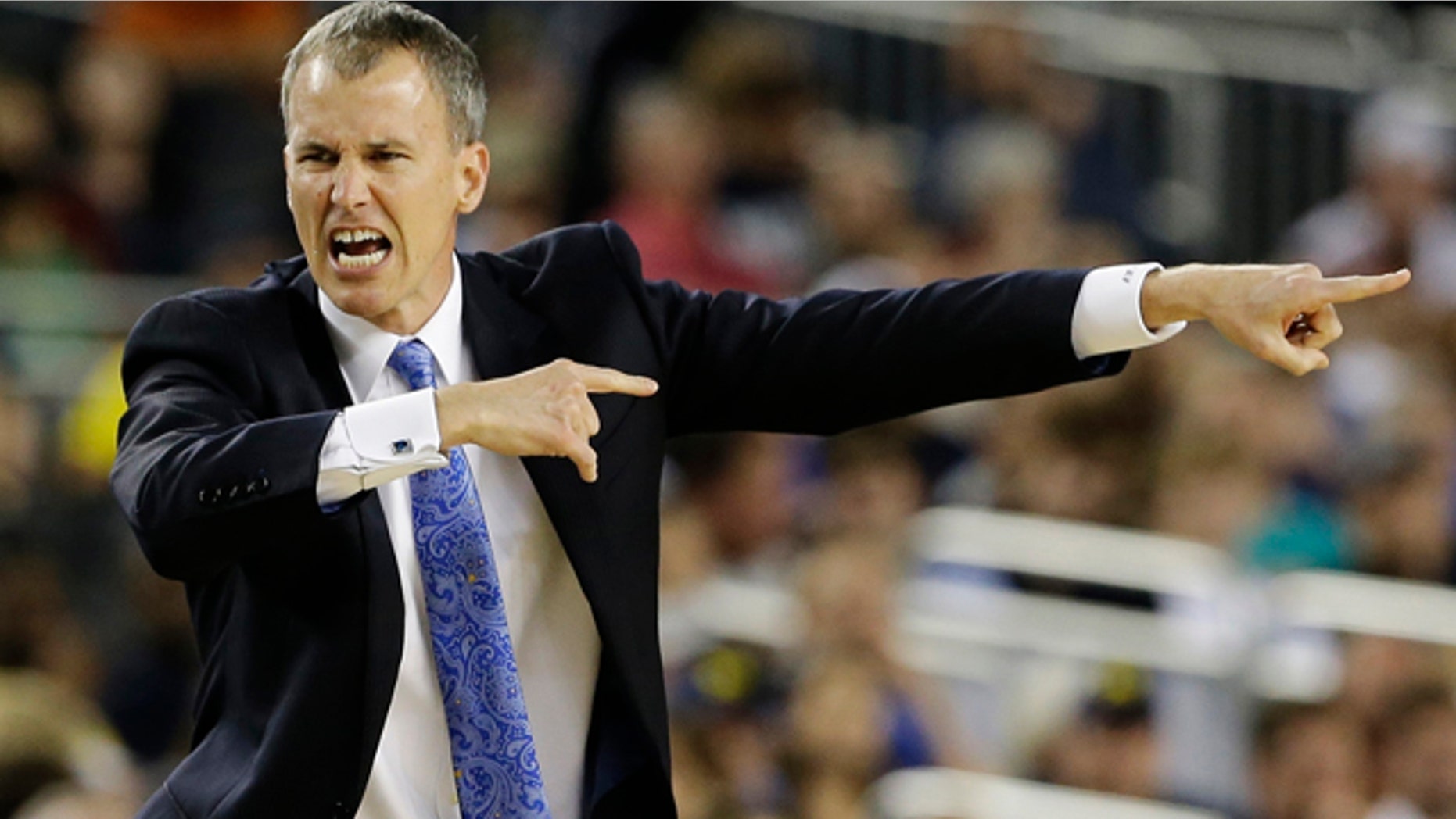 Mar. 30, 2013: Florida Gulf Coast head coach Andy Enfield reacts to action against Florida during the second half of a regional semifinal game in the NCAA college basketball tournament.
