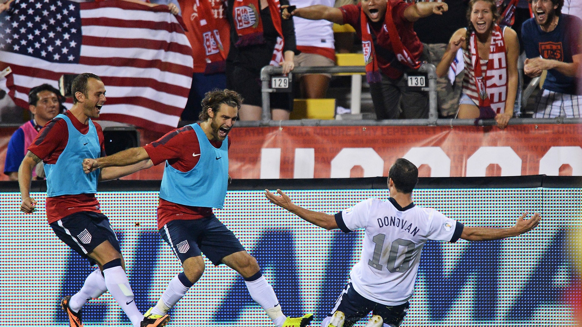 COLUMBUS, OH - SEPTEMBER 10: Landon Donovan #10 of the United States Men's National Team celebrates his second half goal against Mexico with teammates Brad Davis #17 of the United States MenÃs National Team, far left, and Graham Zusi #19 of the United States MenÃs National Team, middle, at Columbus Crew Stadium on September 10, 2013 in Columbus, Ohio. The United States defeated Mexico 2-0. (Photo by Jamie Sabau/Getty Images)