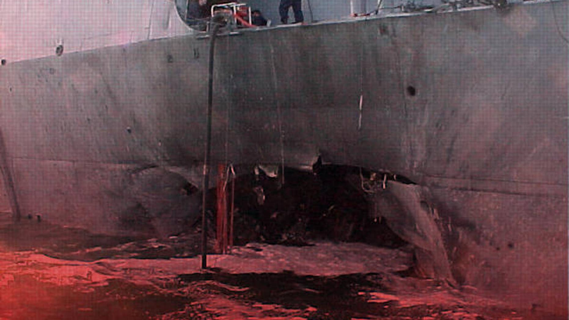 Damage to USS Cole destroyer at port of Aden, Yemen, (AP)