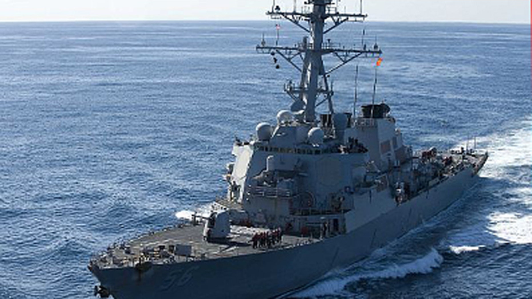 Dec. 5, 2010: The guided-missile destroyer USS John S. McCain approaches the aircraft carrier USS George Washington for a fueling at sea.