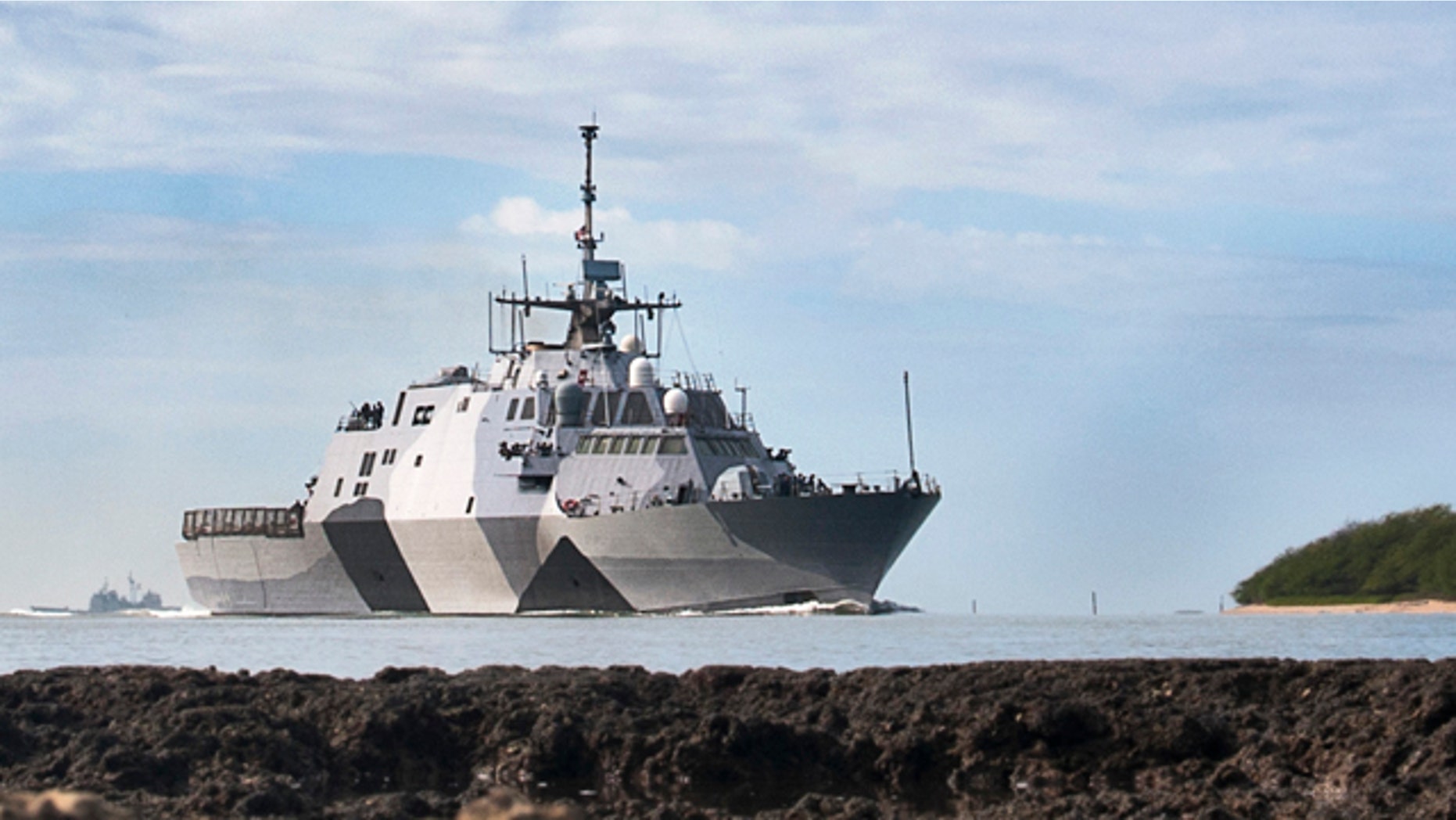 In this photo provided by the U.S. Navy, the USS Freedom littoral combat ship pulls into Pearl Harbor, Hawaii.