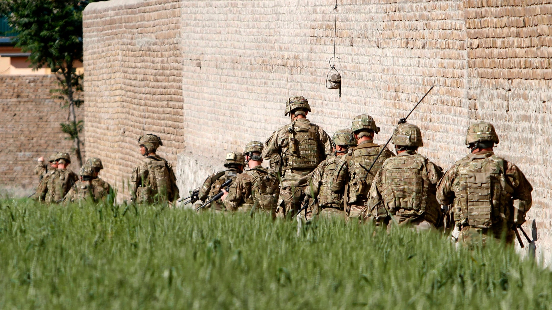 April 15, 2012: U.S. Army soldiers respond after a suicide attack on the US..-led provincial reconstruction team (PRT) compound in the Behsood district of Jalalabad, east of Kabul Afghanistan.