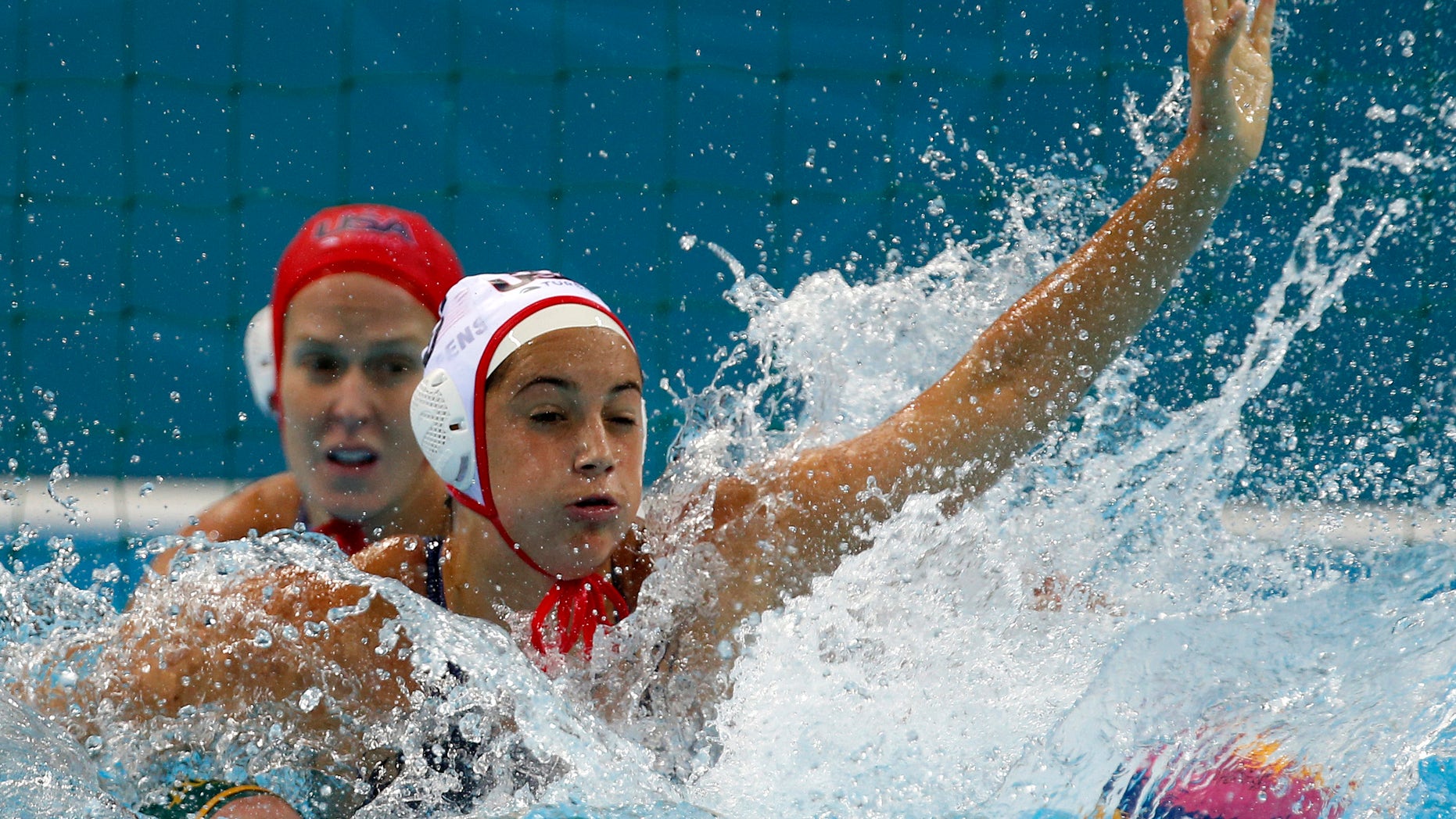 Aug. 7, 2012: Maggie Steffens, top, of the United States defends against Holly Lincoln-Smith of Australia during a women's semifinal water polo match at the 2012 Summer Olympics, in London.