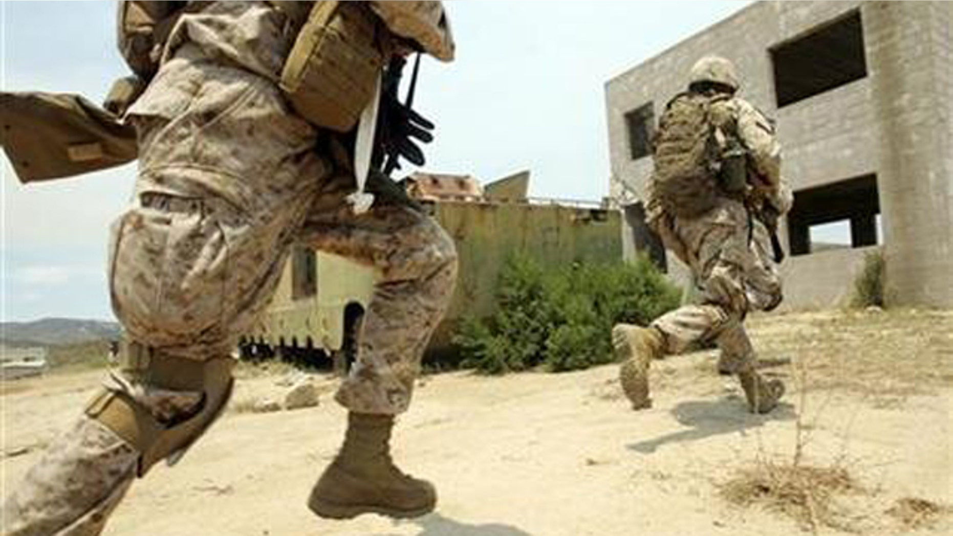 U.S. Marines conduct a search for insurgents during a training simulation of a search through an Iraqi city built at the U.S. Marine Base in Camp Pendleton.