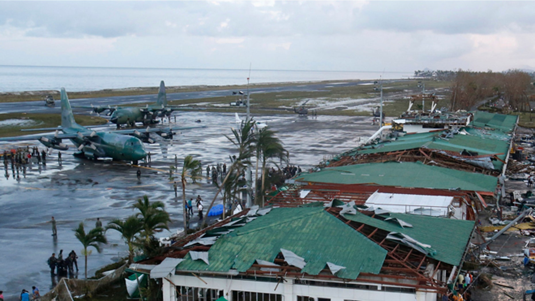 FILE: Nov. 9, 2013: Philippine military C130 cargo planes ferrys supplies park at the tarmac outside an airport after super Typhoon Haiyan battered Tacloban city in central Philippines.