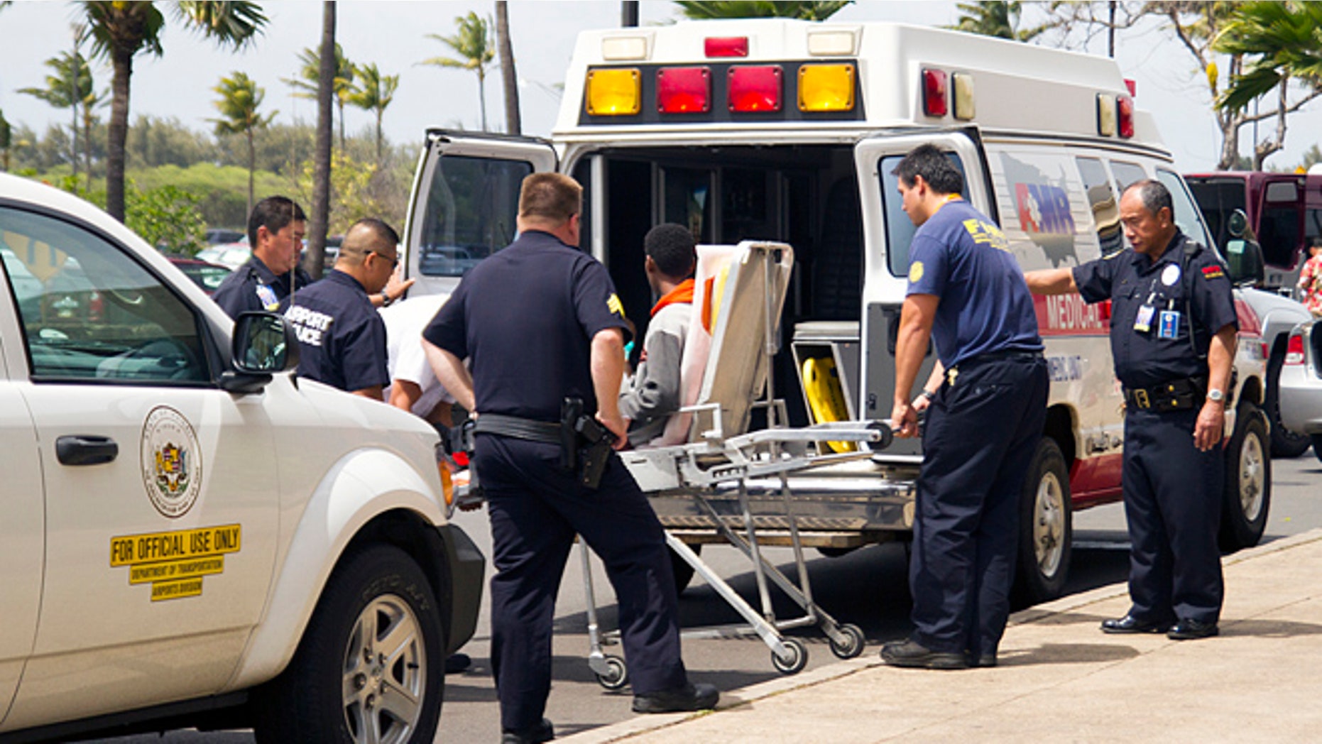 April 20, 2014: In this file photo, a 15-year-old boy, seen sitting on a stretcher center, who stowed away in the wheel well of a flight from San Jose, Calif., to Maui is loaded into an ambulance at Kahului Airport in Kahului, Maui, Hawaii.