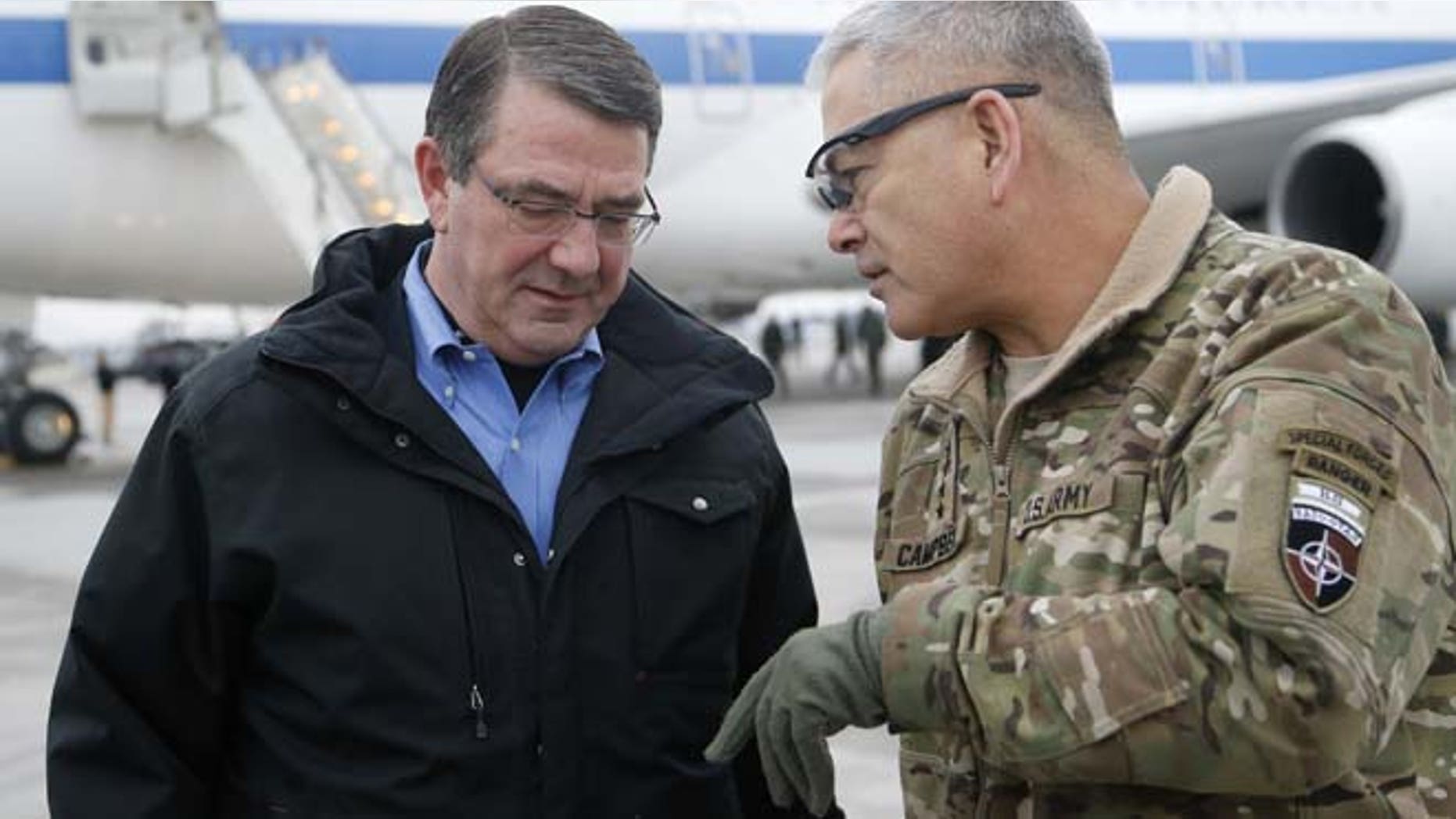 Feb. 21, 2015: In this file photo, U.S. Secretary of Defense Ash Carter, left, walks with U.S. Army Gen. John Campbell upon arrival at Hamid Karzai International Airport in Kabul, Afghanistan. (AP)