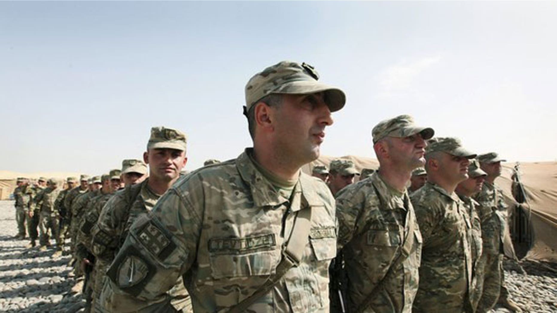 March 14, 2012: Troops from the 31st BN Light Infantry of the Georgian Army wait to meet U.S. Secretary of Defense Leon Panetta at Forward Operating Base Shukvani.