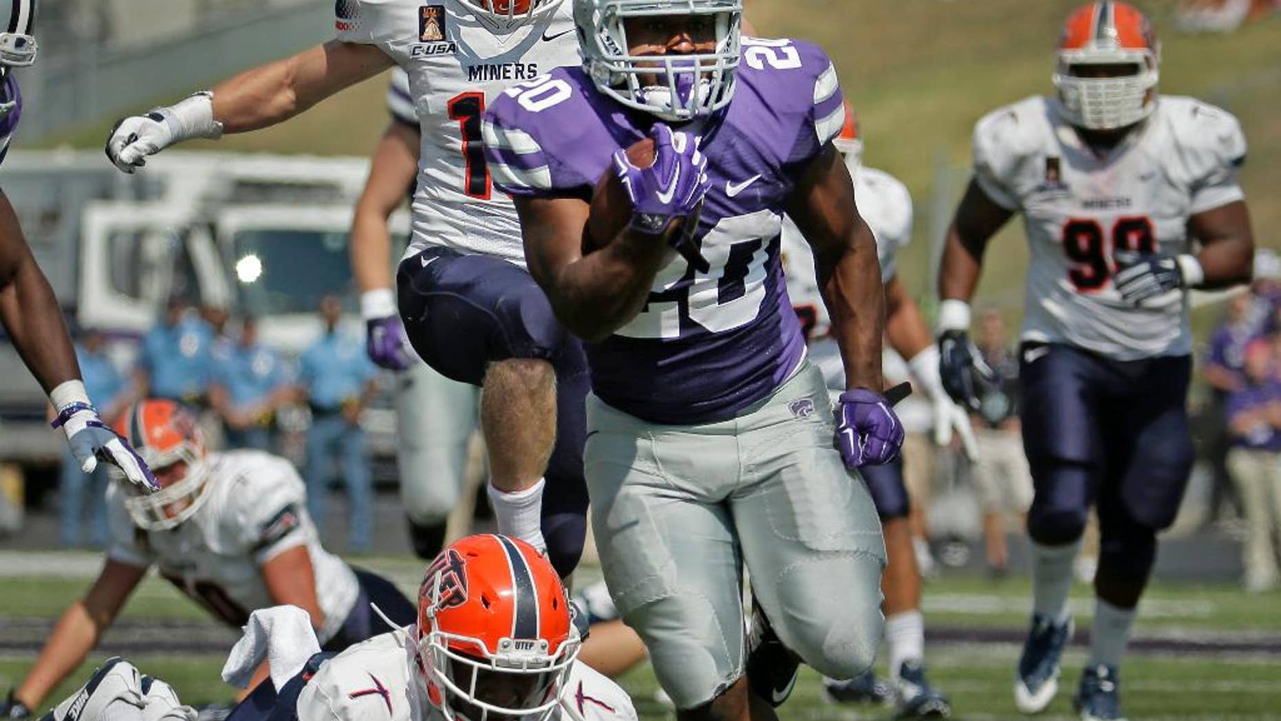 Kansas State running back DeMarcus Robinson (20) is chased by UTEP defenders as he runs for a touchdown during the second half of an NCAA college football game, Saturday, Sept. 27, 2014, in Manhattan, Kan. (AP Photo/Charlie Riedel)