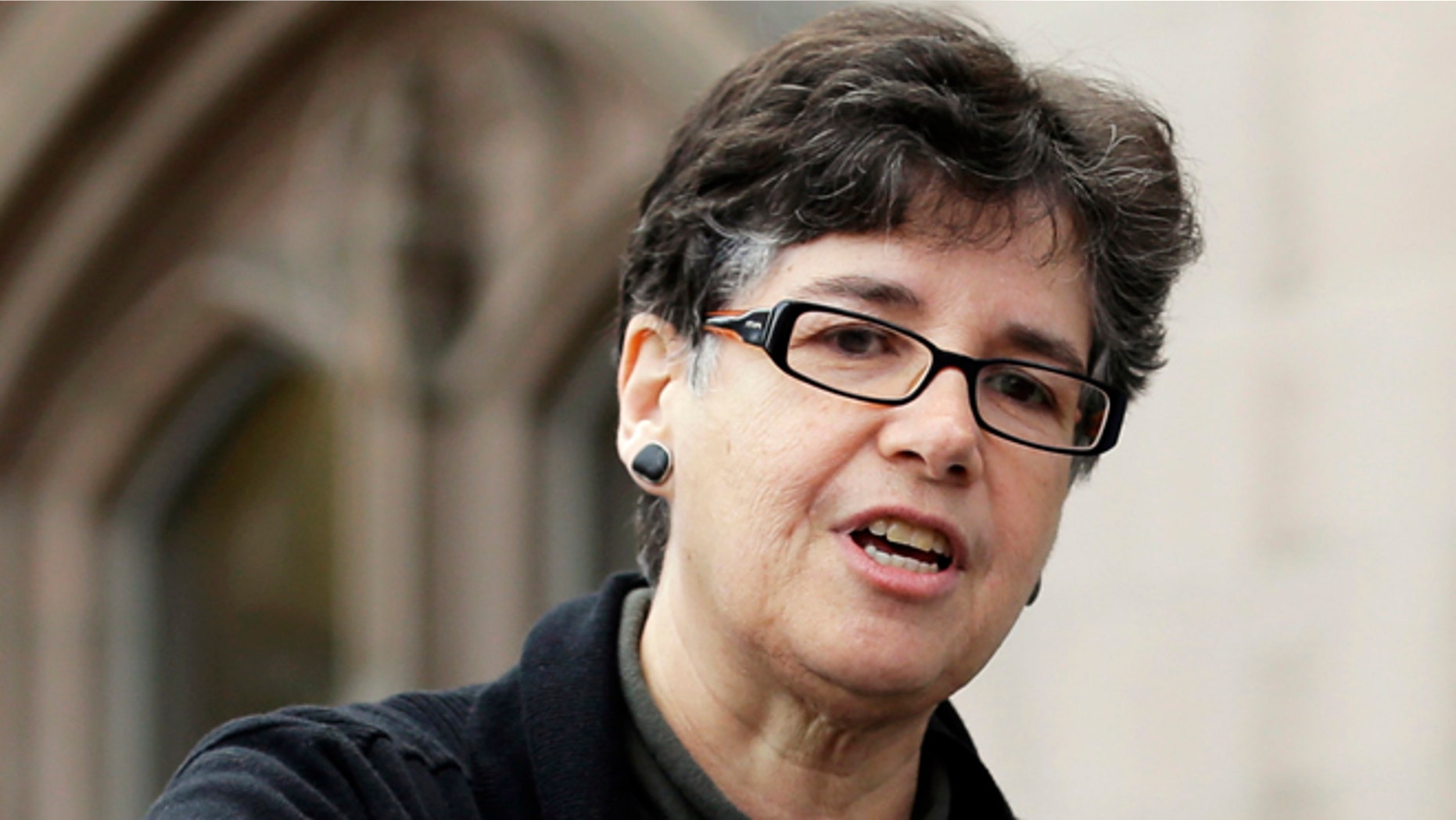 FILE - In this April 1, 2015, file photo, Ana Mari Cauce, University of Washington interim president, addresses students and other supporters who were demonstrating on the university campus in Seattle in support of raising the minimum wage for all campus workers to $15 an hour. The school's Board of Regents on Tuesday, Oct. 13, 2015, chose Cauce to be its next president. Cauce has been interim president since March after Michael Young announced he was leaving UW for Texas A&M University. (AP Photo/Ted S. Warren, File)