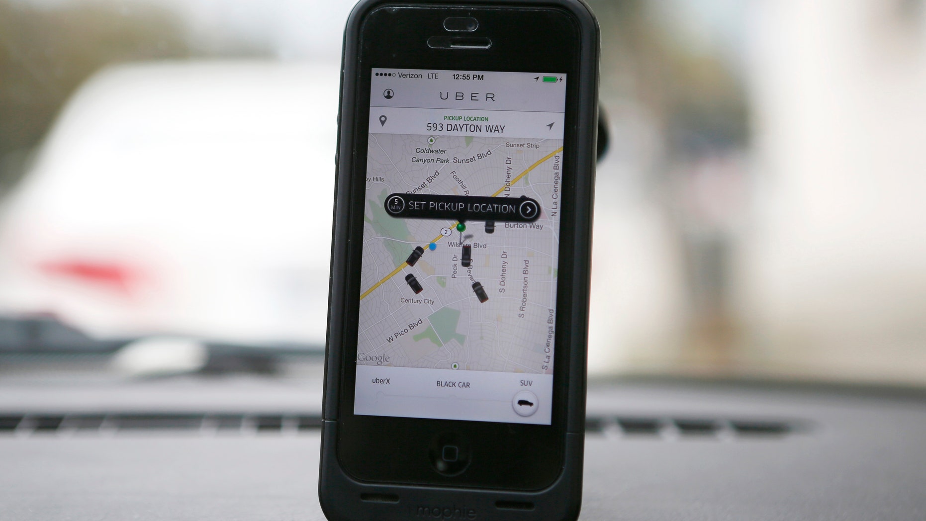 An Uber app is seen on an iPhone in Beverly Hills, California, December 19, 2013.