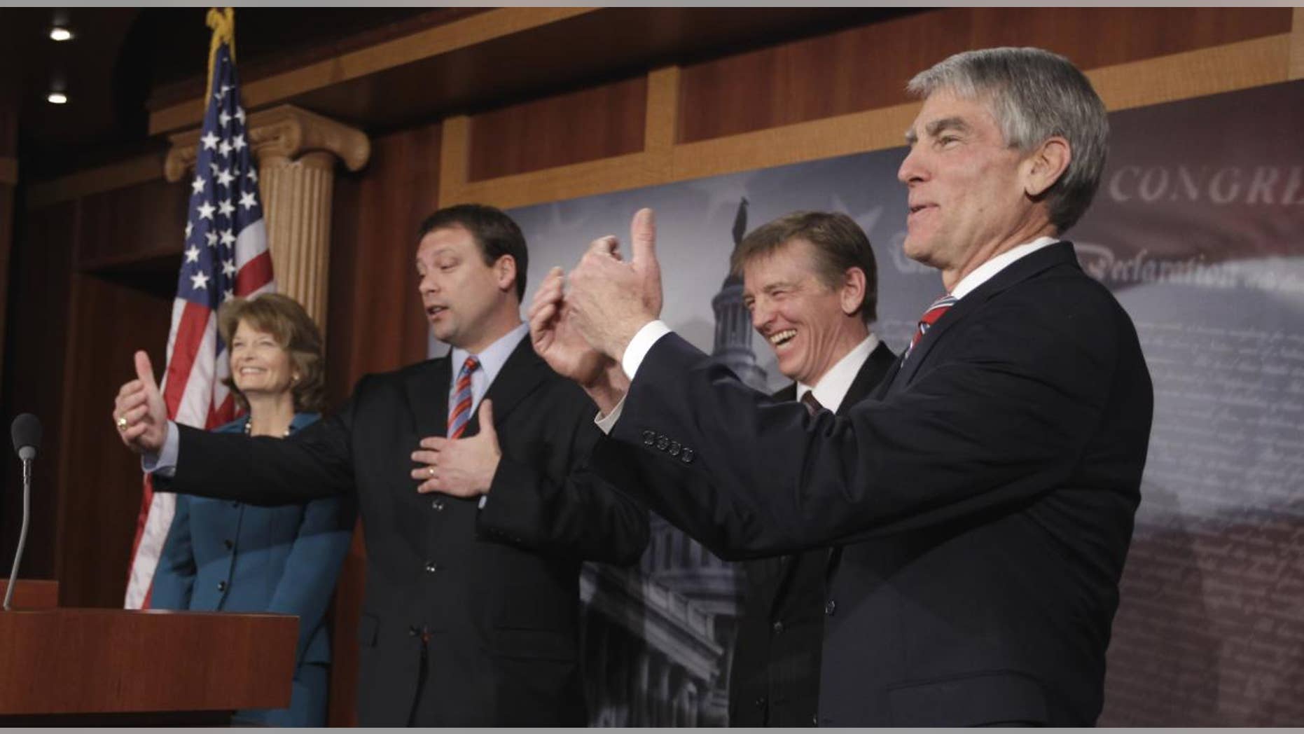 From left, Sen. Lisa Murkowski, R-Alaska, Rep. Heath Shuler, D-N.C., Rep. Paul Gosar, R-Ariz, and Sen. Mark Udall, D-Colo.,take part in a news conference on Capitol Hill in Washington, Tuesday, Jan. 25, 2011, to discuss Democrats and Republicans sitting together during President Barack Obama's State of the Union speech. (AP Photo/Charles Dharapak)