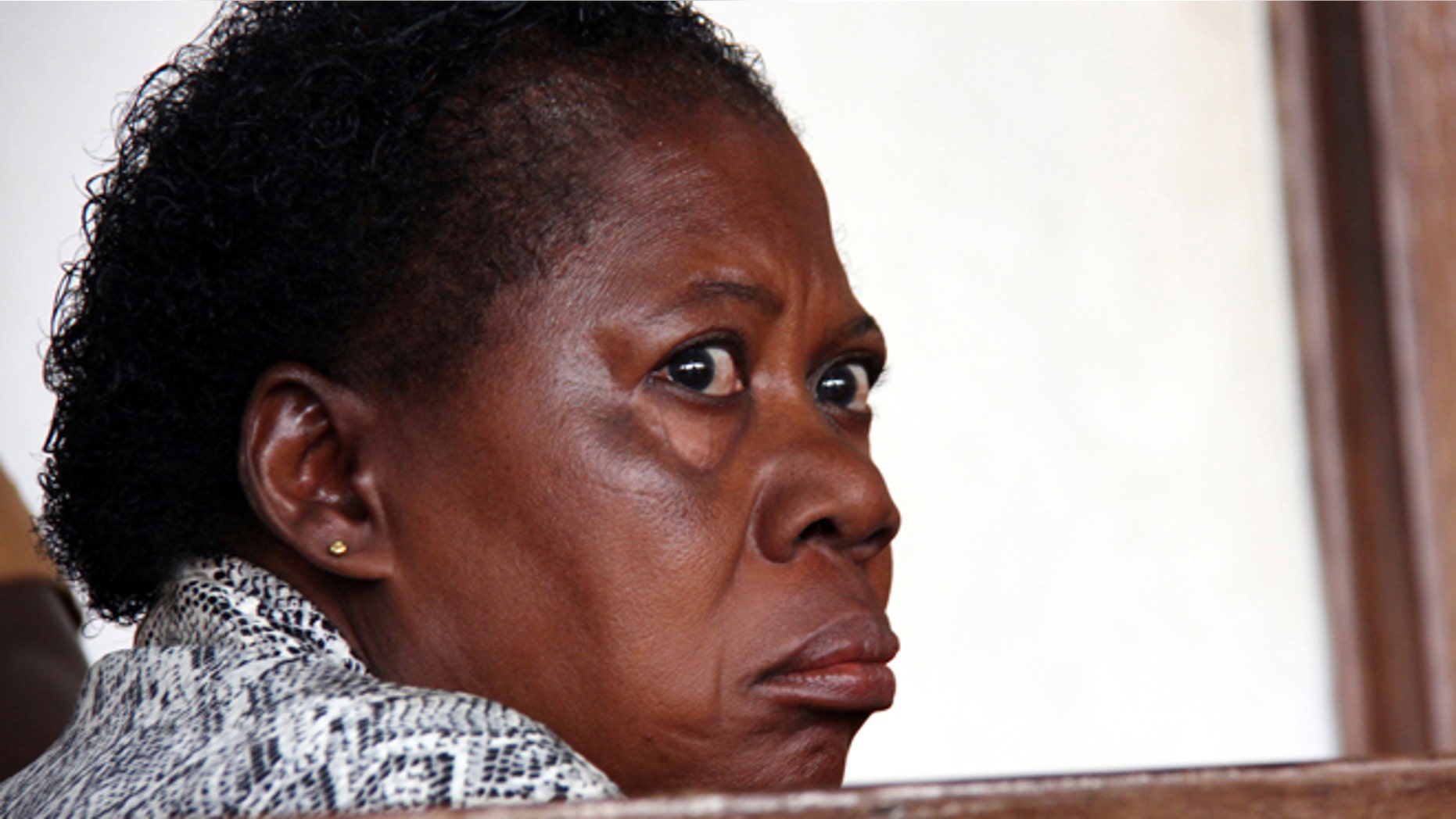March 20, 2014: A Ugandan nurse, Rosemary Namubiru, sits in court in the capital Kampala, Uganda.