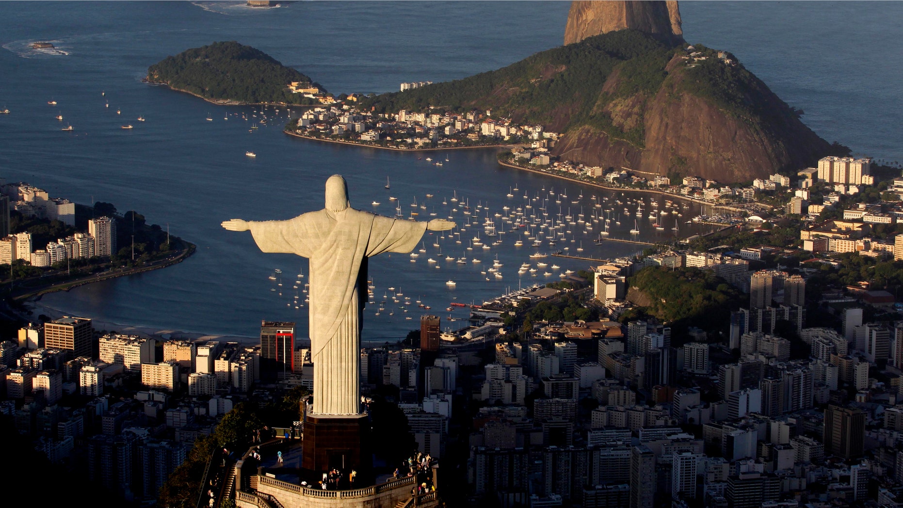 FILE - In this May 30, 2011 file photo, the statue of Christ the Redeemer is seen with the Sugar Loaf mountain at back in Rio de Janeiro, Brazil. That idea of putting up a giant Jesus statue in a London park is not going over well. Brazil's tourist board floated the notion of erecting a 30-foot (9-meter) replica of Rio de Janeiro's Christ the Redeemer statue a symbol of peace and a well-known landmark of the city. The idea would be to promote the 2016 Olympics in Rio. (AP Photo/Felipe Dana, File)