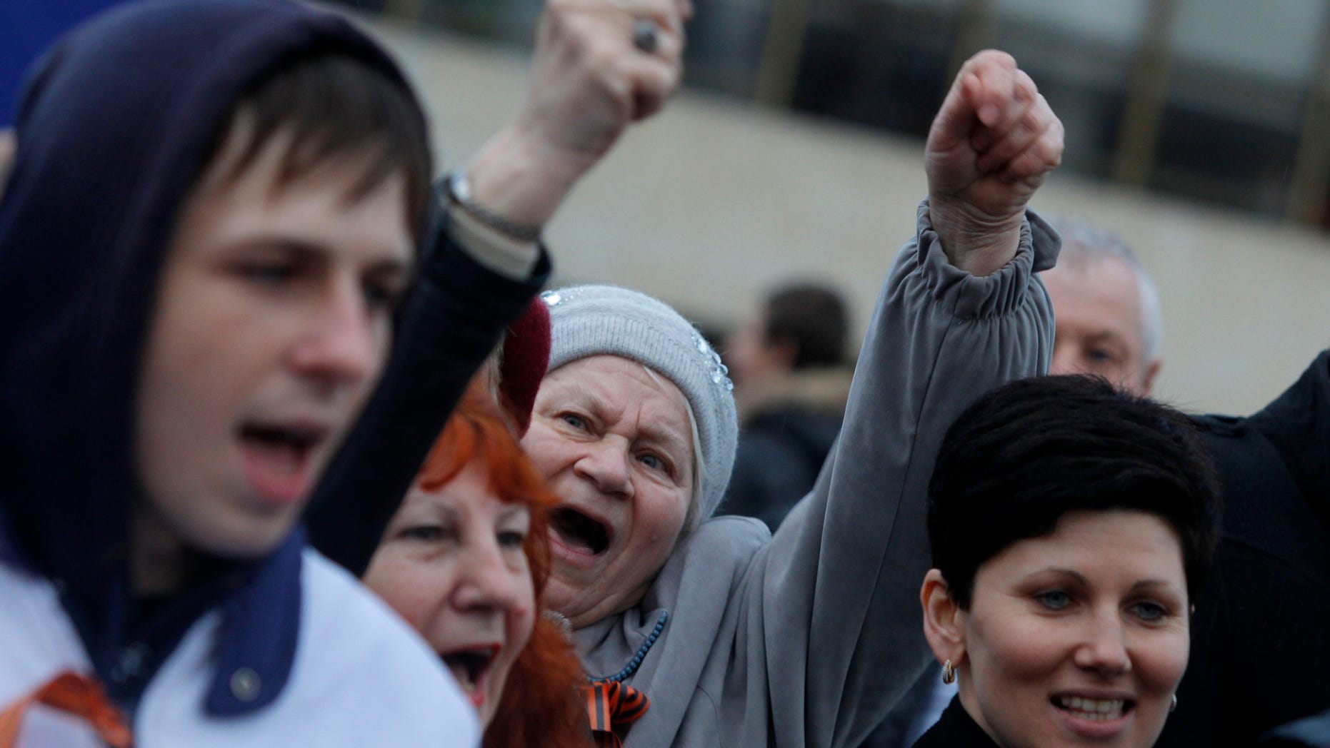 March 5, 2014, pro-Russian supporters chant slogans during a rally at a central square in Simferopol, Ukraine.