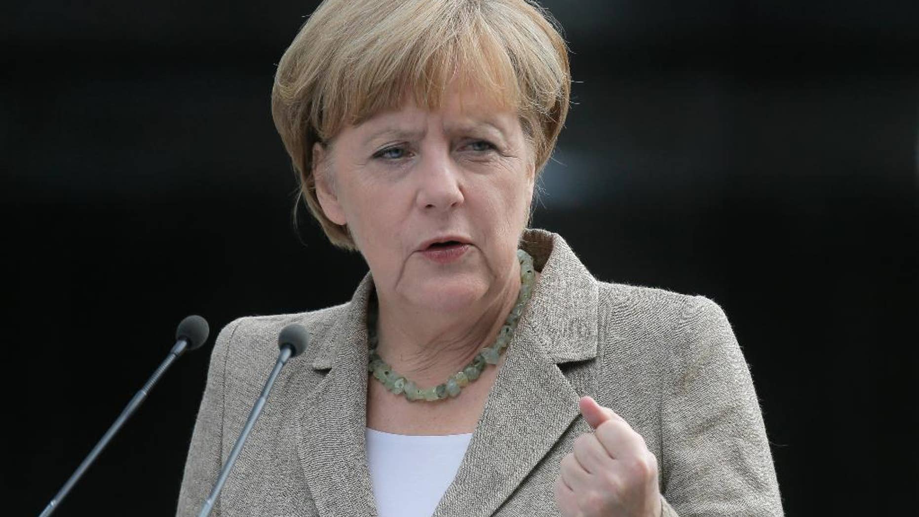 German chancellor Angela Merkel make a statement to the press in Kiev, Ukraine, Saturday, Aug. 23, 2014. German Chancellor Angela Merkel, who has advocated a measured European Union response to Russia’s aggressive policies in Ukraine, met Saturday in Kiev to meet Ukrainian President Petro Poroshenko and said she urged a political solution to the crisis. Poroshenko, for his part, said Ukraine was willing to try to solve the conflict by talks, but not at the expense of the country’s territorial integrity or sovereignty. (AP Photo/Efrem Lukatsky)