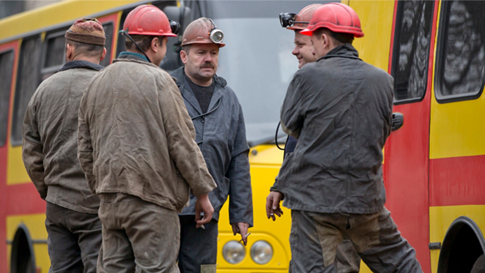 March 4, 2015: Miners gather outside after an explosion at the Zasyadko coal mine in Donetsk, Ukraine. An explosion took place underground at the Zasyadko coal mine in war-torn eastern Ukraine on Wednesday, an area controlled by pro-Russian rebels. (AP Photo/Vadim Ghirda)