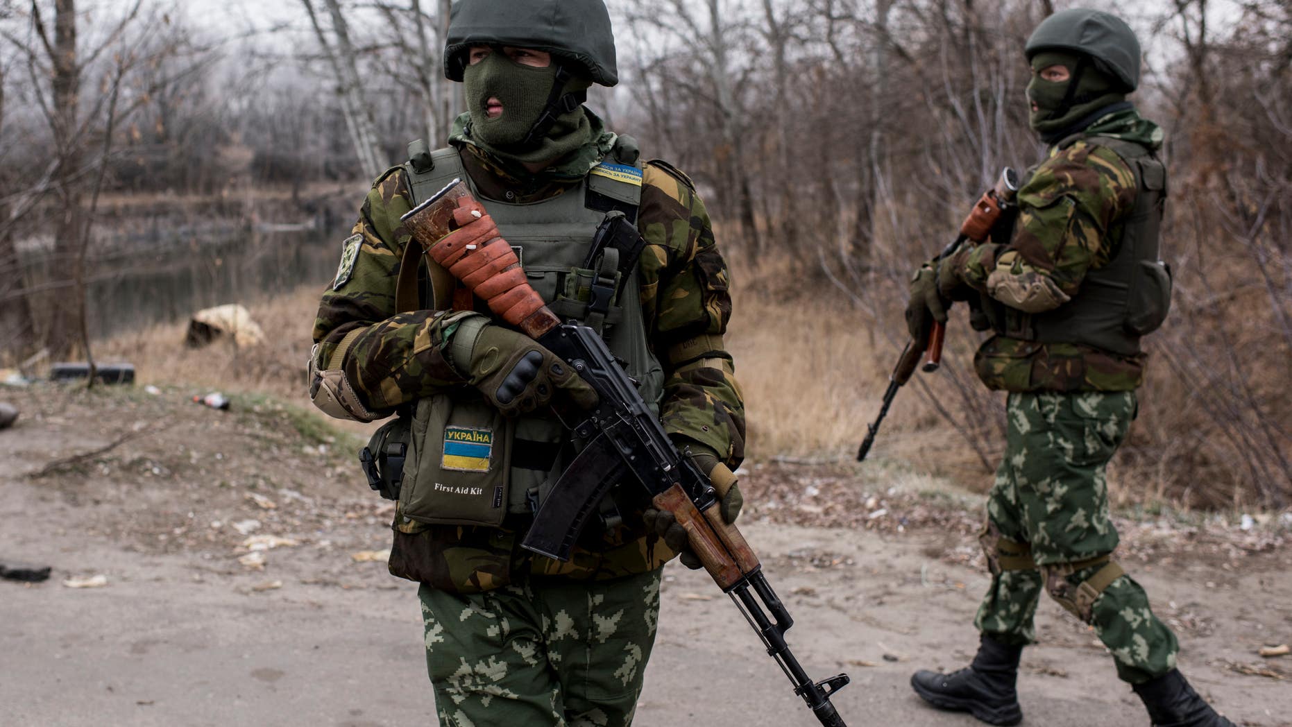 Nov 23, 2014 - FILE photo of Ukrainian servicemen near a bridge over the river Siverskiy Donets, damaged by explosion during fighting between Pro-Russian rebels and Ukrainian government forces near Trehizbenka village, Luhansk region eastern Ukraine. More than 4,700 people have died in fighting in eastern Ukraine over the past half year, according to UN estimates. (AP)