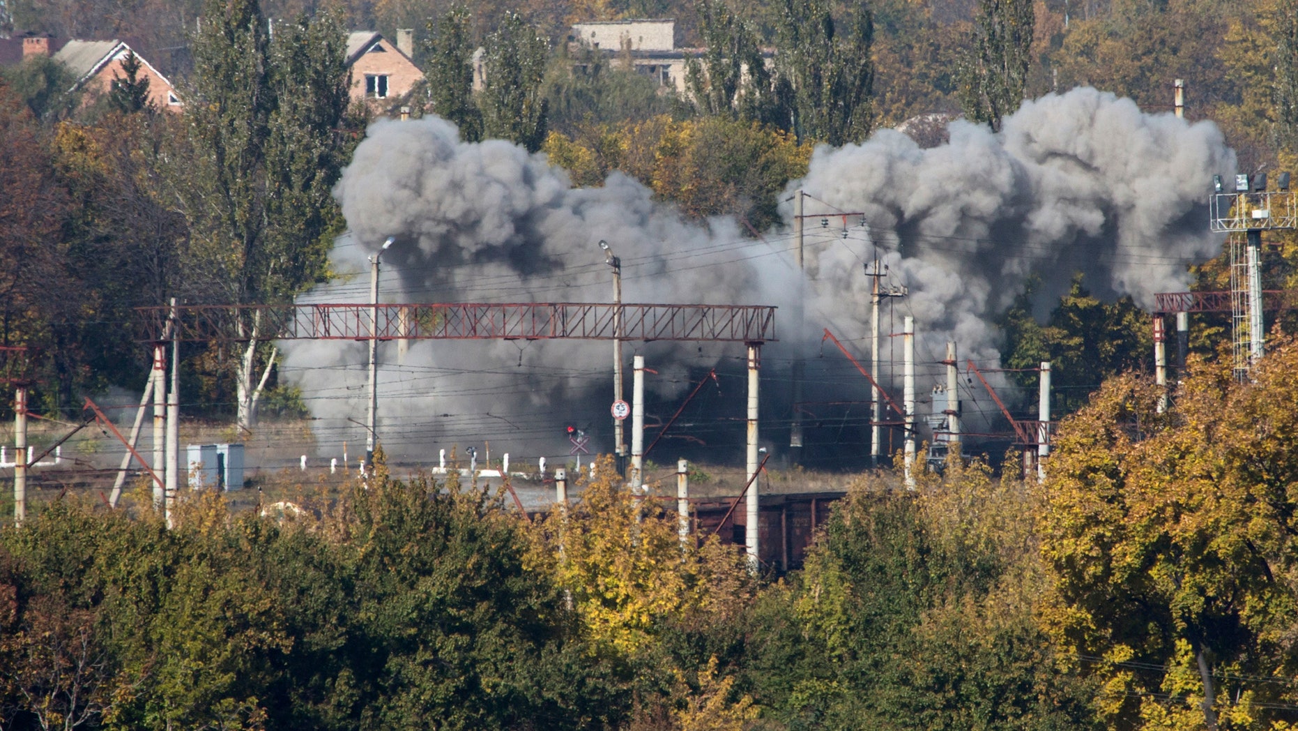 Oct. 12, 2014 - FILE photo of a shell exploding at a rail road near the Donetsk airport, during an artillery battle between pro-Russian rebels and Ukrainian government forces in eastern Ukraine. Poland's defense minister tells the AP the country will move thousands of troops toward its eastern borders in a historic realignment of a military structure. The troops are needed east because of the conflict in neighboring Ukraine.