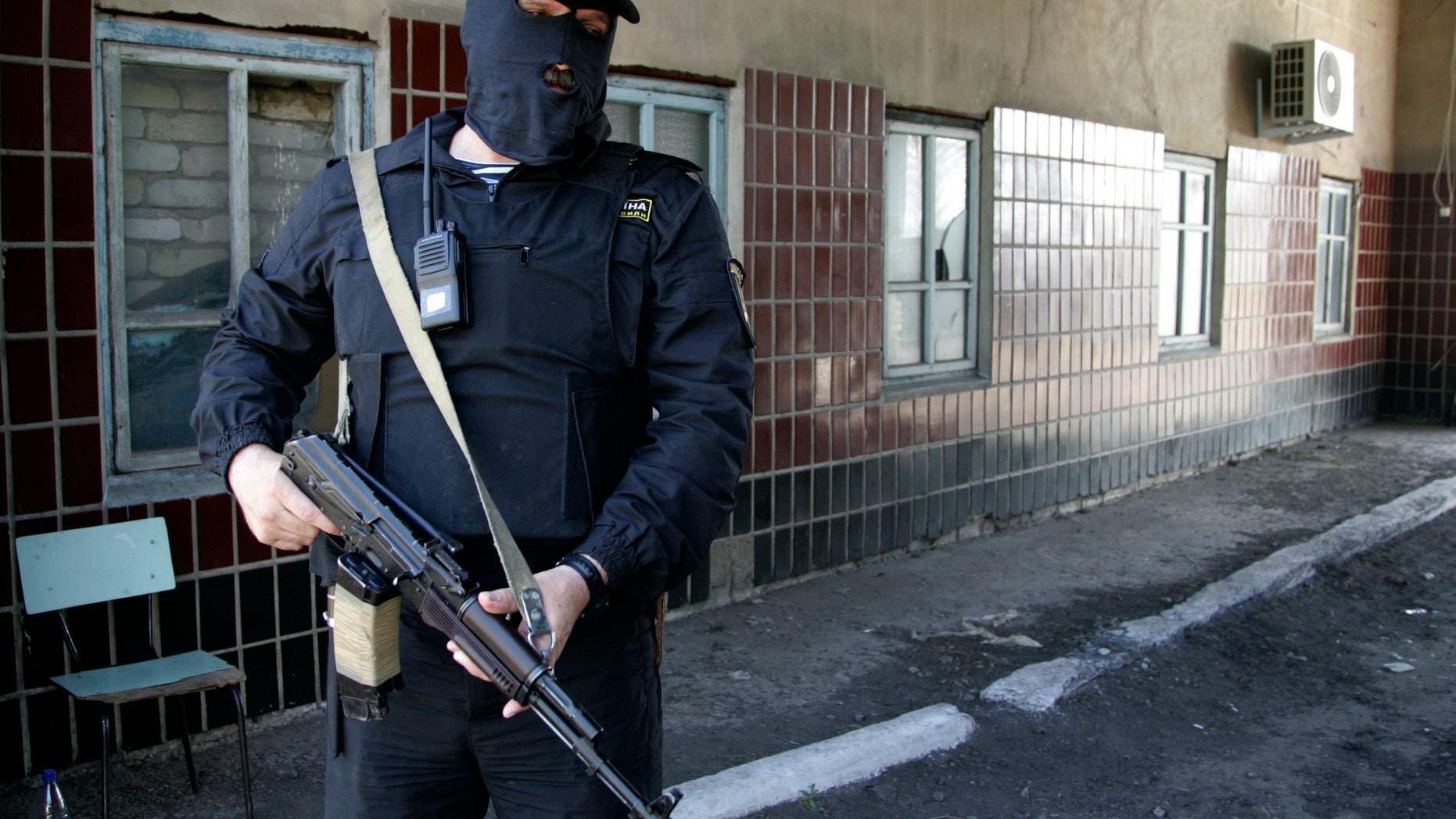 May 16, 2014 - An armed man of the Donbass Battalion, a non-affiliated militia group that has stated its intent to fight in support of Ukrainian unity, is on guard at a base near Donetsk, eastern Ukraine. The group says it has reclaimed Velyka Novosilka from pro-Russian separatists with the self-styled Donetsk Peoples Republic, an anti-government movement that has over the past few weeks been seizing government offices and declared its intent to merge the Donetsk region with Russia.