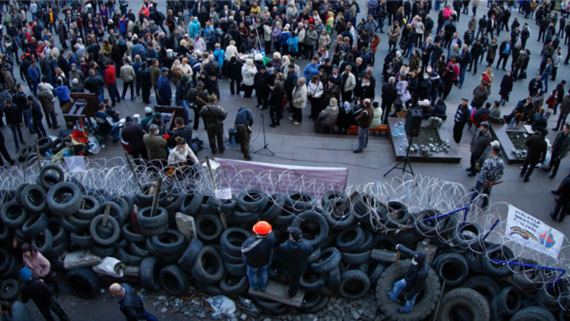April 7, 2014: People gathered in front of a barricade at the regional administration building in Donetsk, Ukraine. (AP Photo/Andrey Basevych)