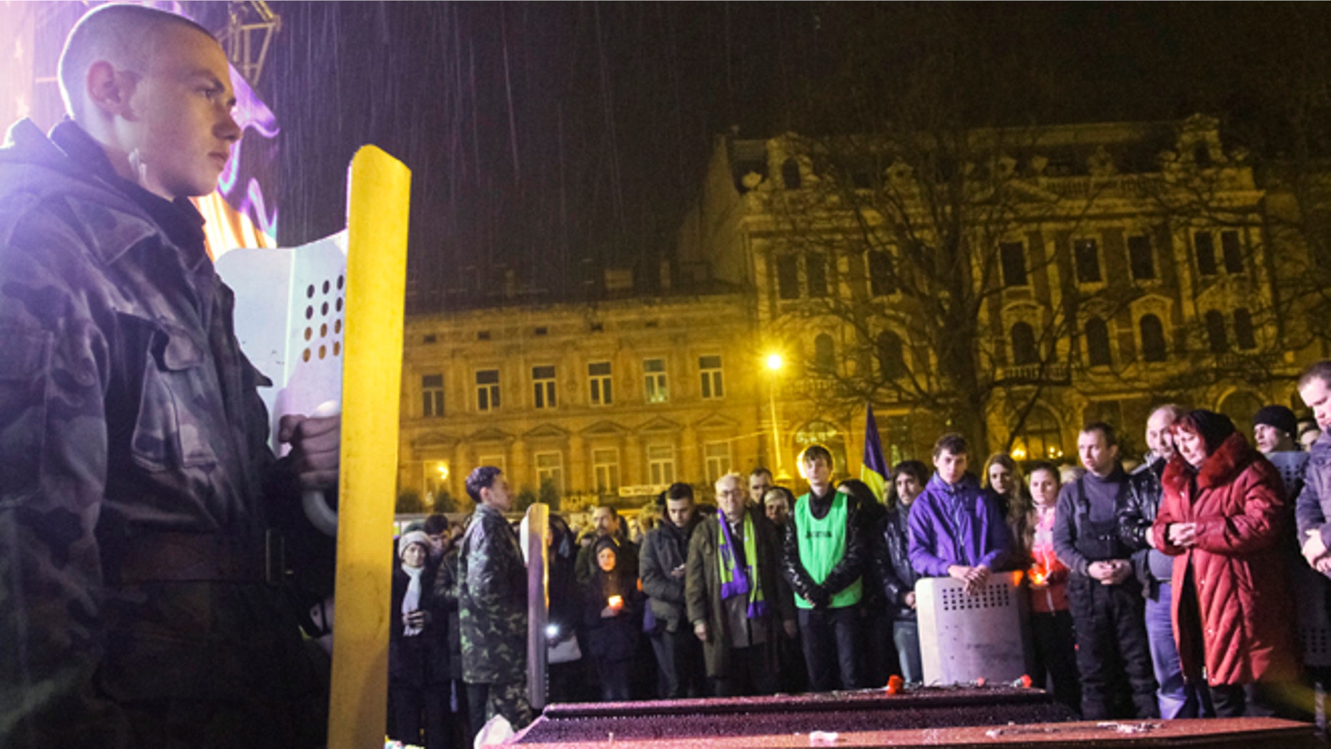 FILE: February 21, 2014: A funeral for an anti-government protester who was killed during clashes with riot police, in Lviv, Ukraine.