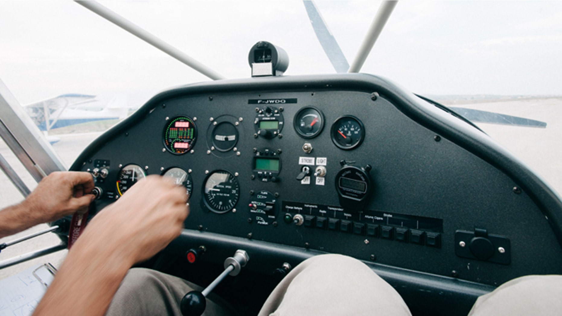 Inside the cockpit of an ultralight plane, just before take off. (Photo: Fred Pauwels/Getty)
