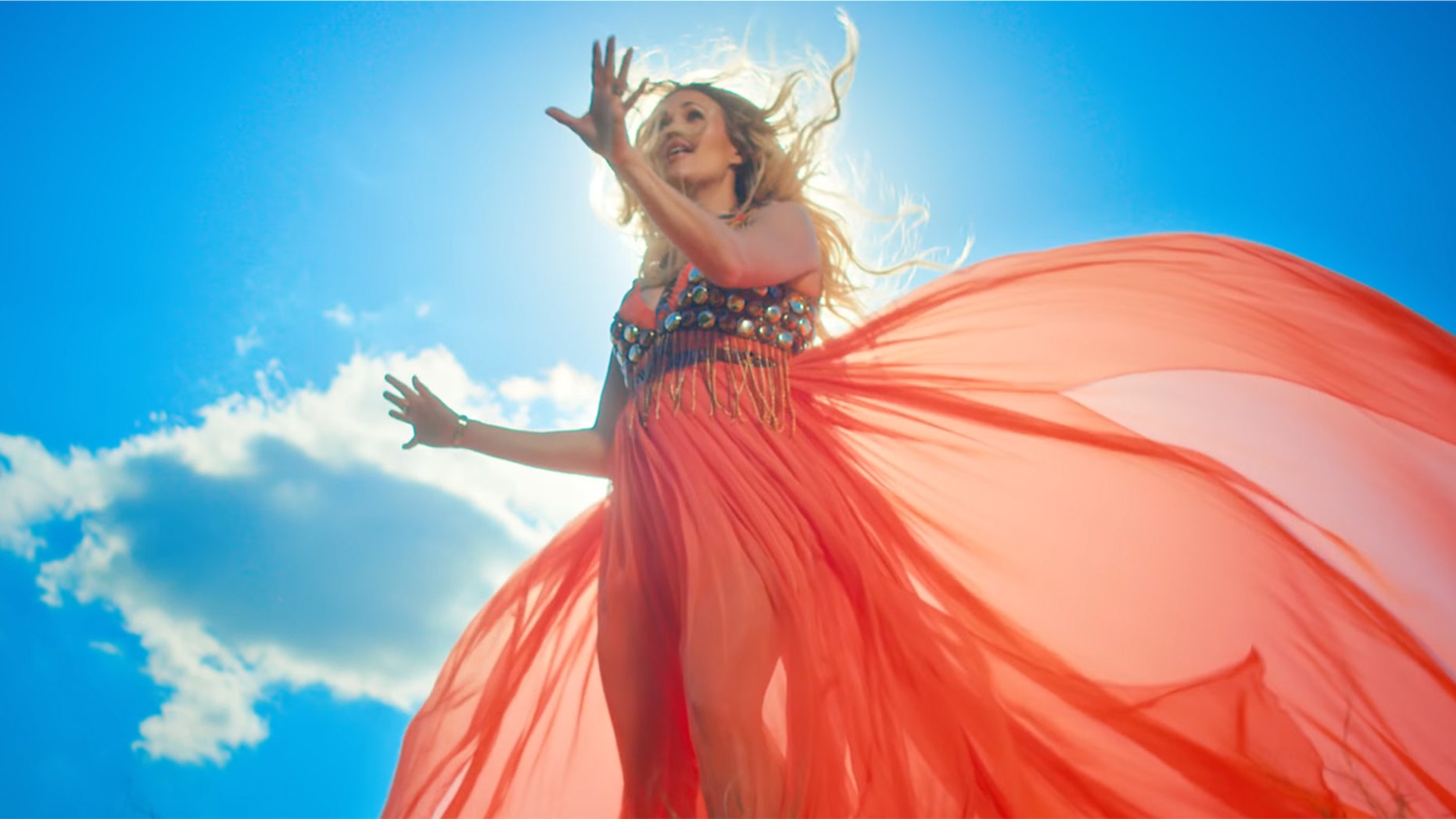 Carrie Underwood gave fans a glimpse of her baby bump in her new music video for "Love Wins."