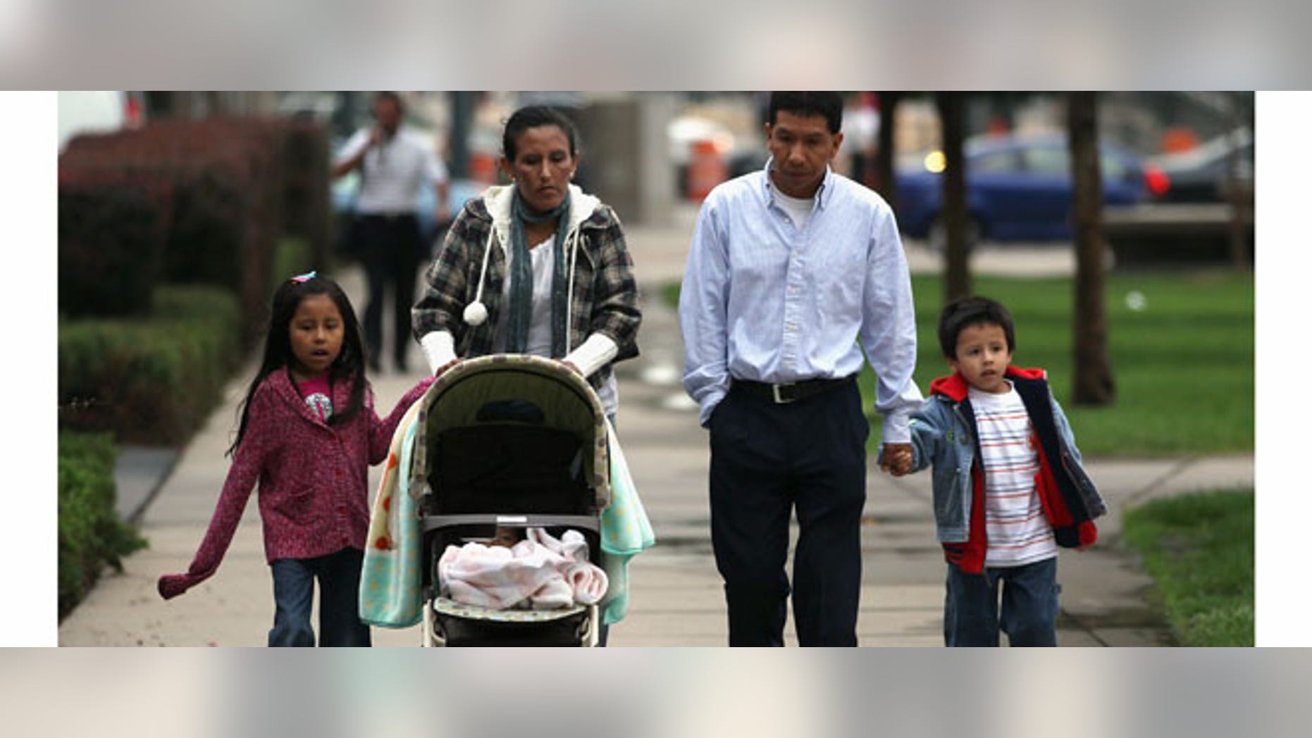 Undocumented Mexican immigrant Jeanette Vizguerra (L), her husband Salvador and their children Luna, 7, and Roberto, 5, walk to her immigration hearing in federal court on July 13, 2011 in Denver, Colorado.