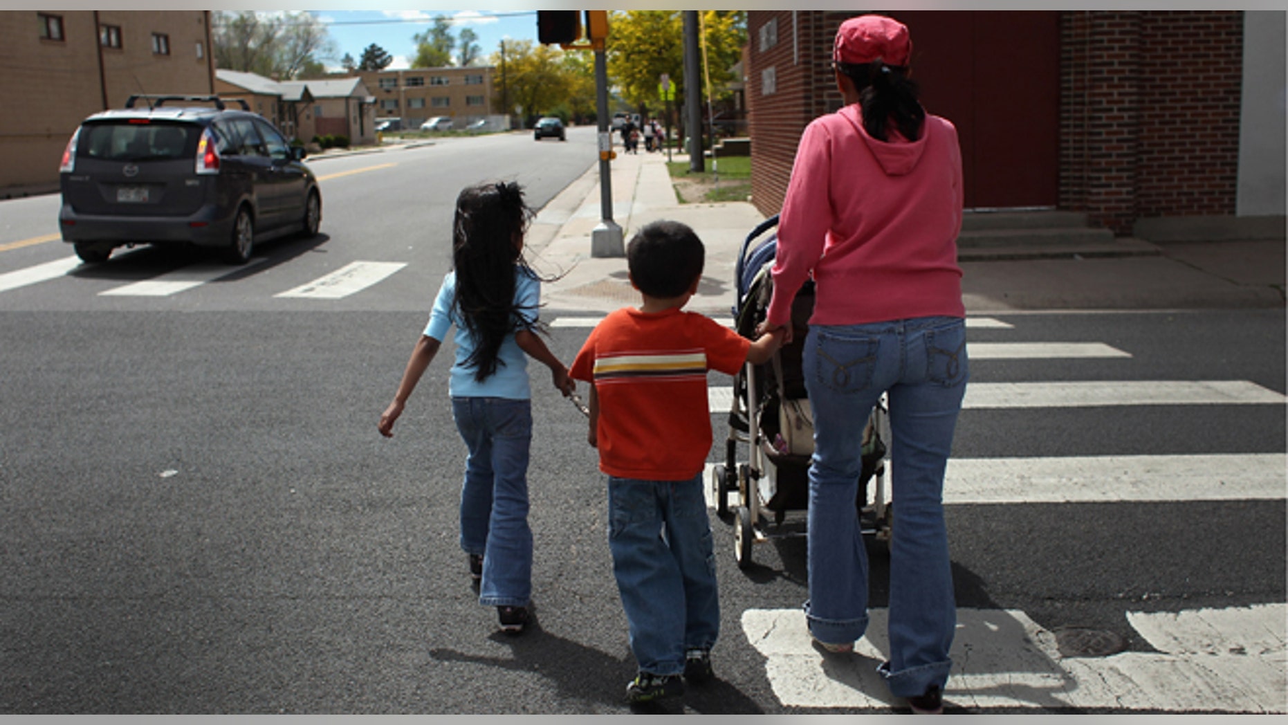 AURORA, CO - MAY 21: Undocumented Mexican immigrant Jeanette Vizguerra walks home with her three American-born children on May 21, 2011 in Aurora, Colorado. Vizguerra is facing deportation to Mexico and is scheduled for a final hearing July 13 at Denver's Federal Courthouse. Just one of millions of undocumented immigrants living in the United States, Vizguerra first came to Colorado from Mexico City with her husband 14 years before. She is a small business owner of a janitorial service and a community organizer for immigration rights. Stopped two years ago by a traffic policemen for driving with expired tags, Vizguerra was taken to jail when she could not prove she was in the country legally. Out on bail during lengthy court proceedings, she now faces the real possibility that she will be deported back to Mexico and separated from her family in the United States. (Photo by John Moore/Getty Images)