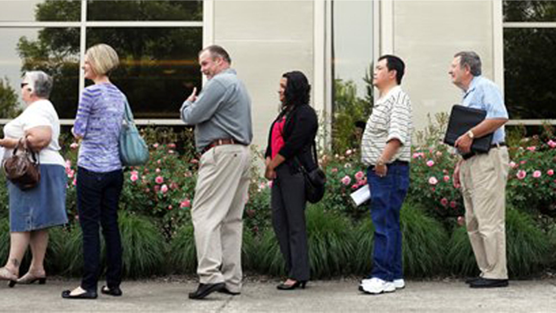May 30, 2012: Dozens of people line up to seek a job at the Wells Fargo call center in Salem, Ore.