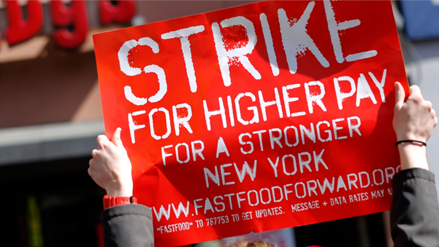 FILE: April 4, 2013: Demonstrators protesting low wages and the lack of union representation in the fast food industry outside in the Brooklyn Borough of New York.