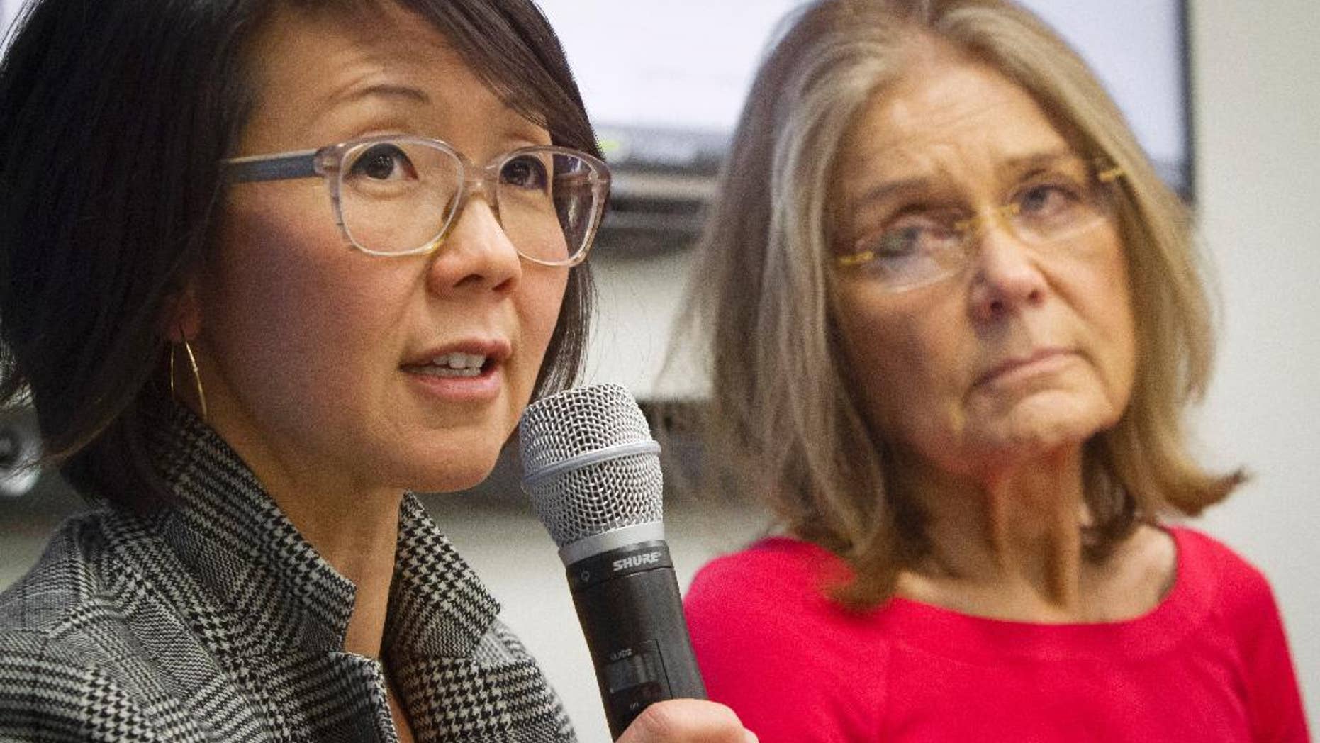 FILE - Organizers of the effort called WomenCrossDMZ.org, including lead coordinator Christine Ahn, left, and honorary co-chair Gloria Steinem, right, hold a United Nations news conference announcing plans for a rare and risky women's walk across the demilitarized zone between North and South Korea to call for reunification, in this March 11, 2015 file photo. Ahn said in an email Friday April 3, 2015 they have Pyongyang's cooperation and support.". (AP Photo/Bebeto Matthews, File)