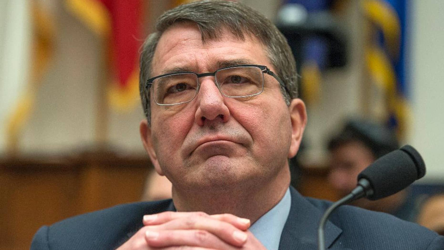 FILE - In this March 18, 2015 file photo, Defense Secretary Ash Carter listens on Capitol Hill in Washington. To put a spotlight back on Asia, Carter will visit Japan and South Korea this week, the first of a string of planned trips to the region during his first year as Pentagon chief. He will visit India and attend an international security conference in Singapore in May, and he may visit China later in the year. (AP Photo/Molly Riley, File)