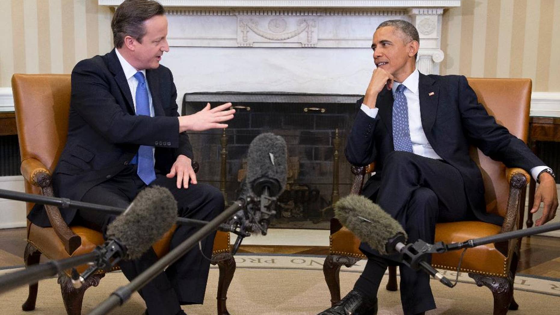 FILE - In this Jan. 16, 2015 file photo, President Barack Obama meets with British Prime Minister David Cameron, in the Oval Office of the White House in Washington. U.S. Sen. Lindsey Graham, a leading Republican critic of Obama's foreign policy, is pushing new sanctions against Iran over its nuclear program, unswayed by a White House veto threat and lobbying by Britain's leader. (AP Photo/Carolyn Kaster, File)