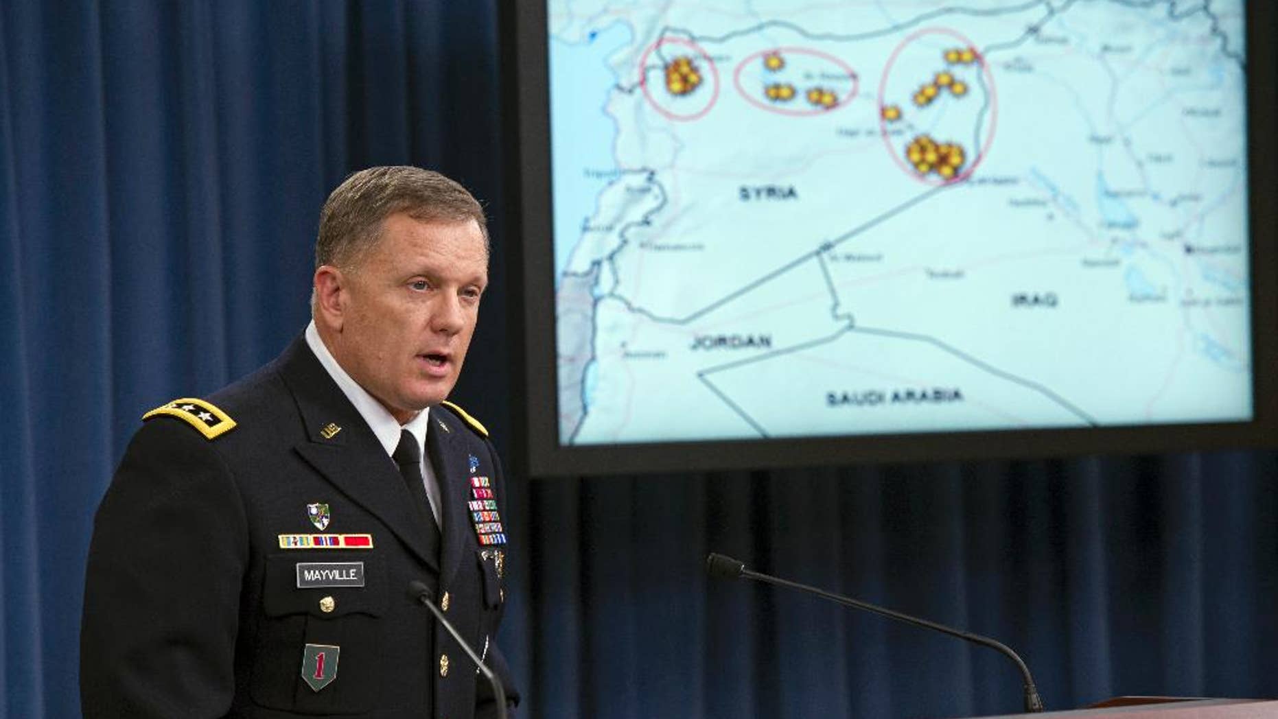 FILE - In this Tuesday, Sept. 23, 2014, file photo, Army Lt. Gen. William Mayville, Jr., Director of Operations J3, speaks about the operations in Syria during a news conference at the Pentagon. According to current and former U.S. officials, the Pentagon is grappling with significant intelligence gaps as it bombs Iraq and Syria, and it is operating under less restrictive targeting rules than those President Barack Obama imposed on the CIA drone campaign in Pakistan and Yemen. (AP Photo/Cliff Owen, File)