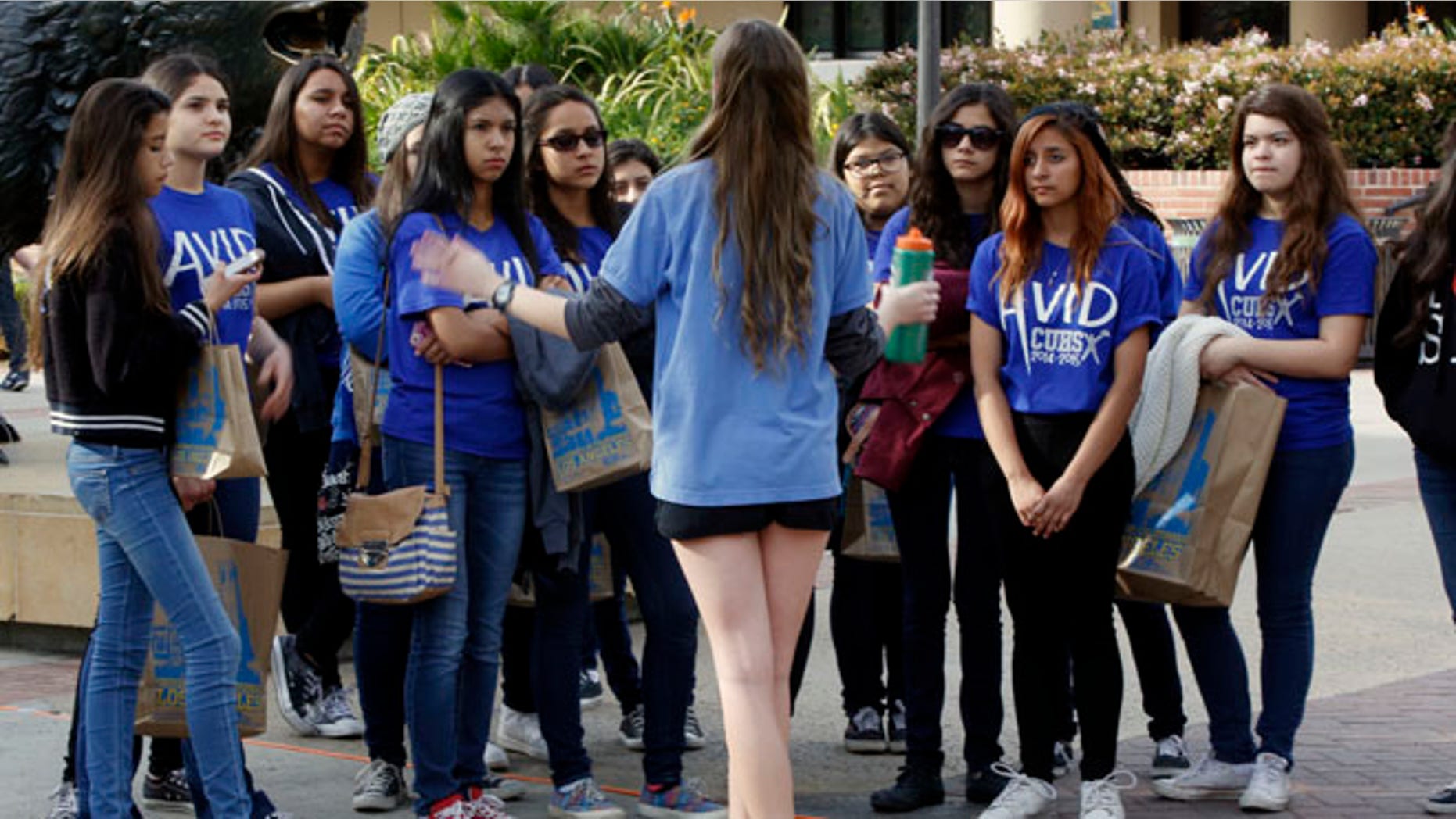 Feb. 26, 2015: UCLA campus tour guide Samantha St. Germain, a bioengineering student, middle, leads prospective college-bound high school seniors on a campus tour in Los Angeles.