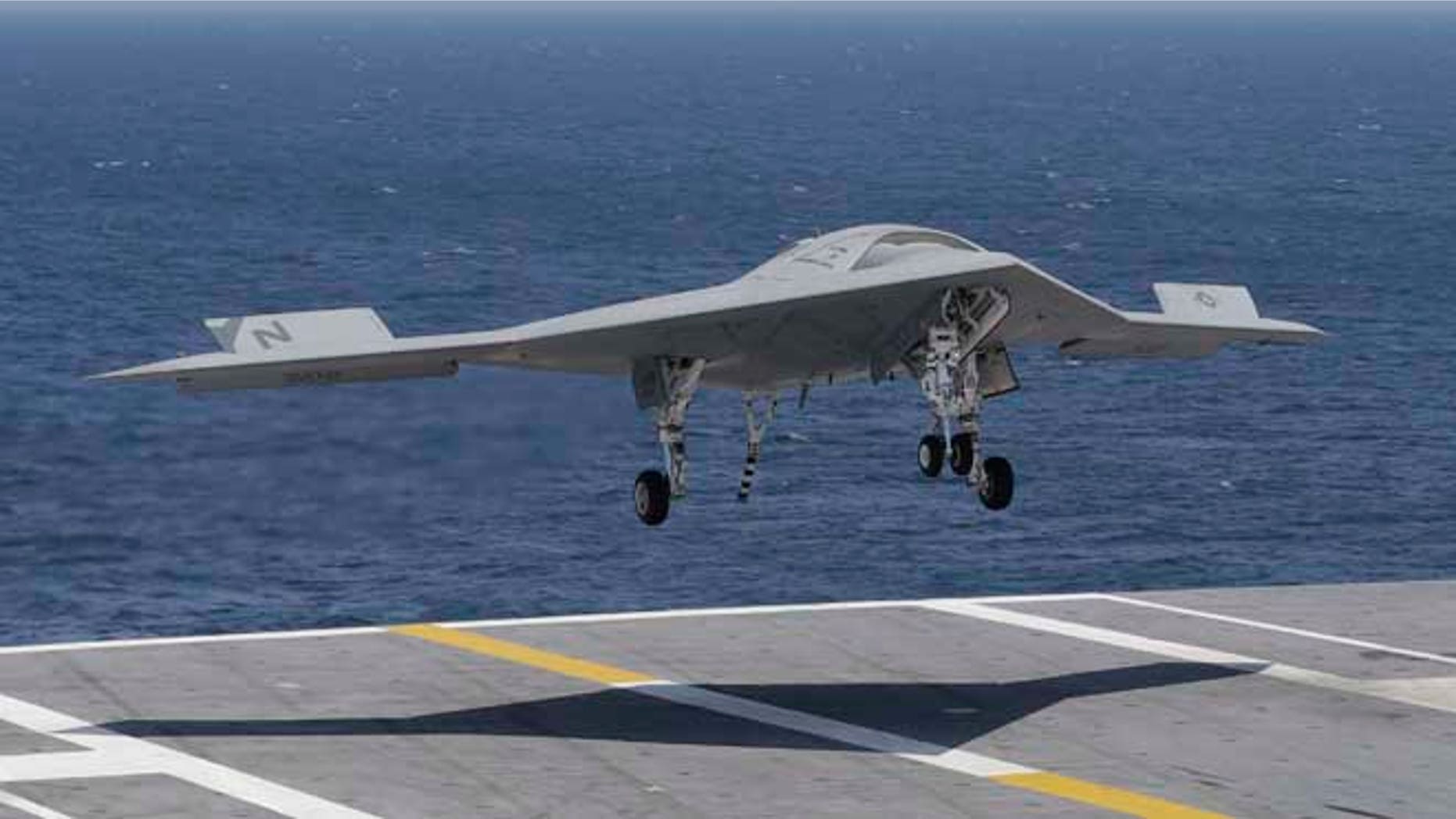 July 10, 2013: A X47-B Navy drone approaches the deck as it lands aboard the nuclear aircraft carrier USS George H. W. Bush off the Coast of Virginia.
