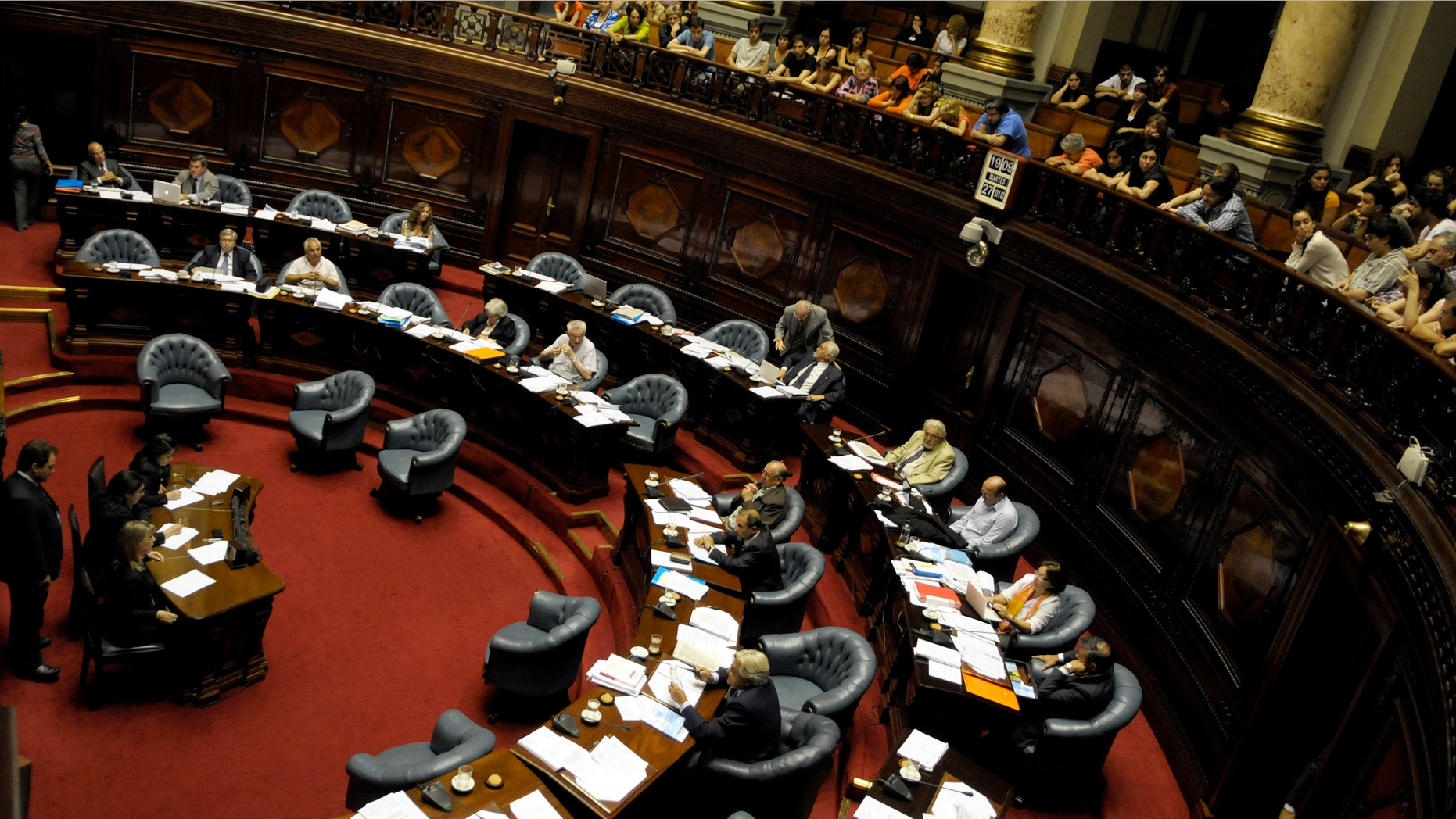 Members of the Uruguayan Senate attend a session in Montevideo, Uruguay, Tuesday Dec. 27, 2011. The Uruguayan Senate would approve a bill to decriminalize abortion, after an initiative vetoed by former President Vazquez in 2008. (AP Photo/Matilde Campodonico)