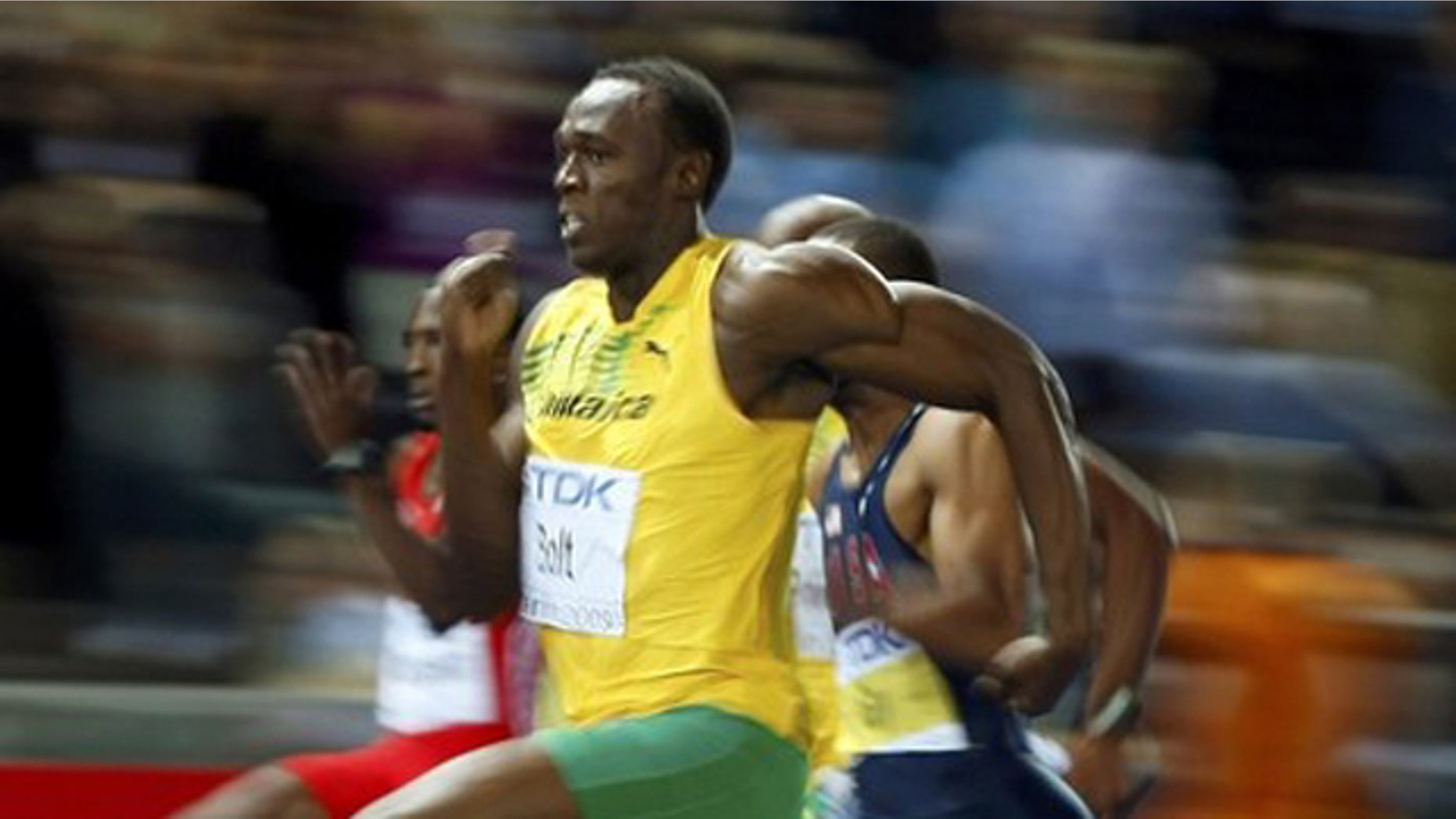 Usain Bolt of Jamaica sprints to the finish to win in the men's 100 meters final during the world athletics championships at the Olympic stadium in Berlin.