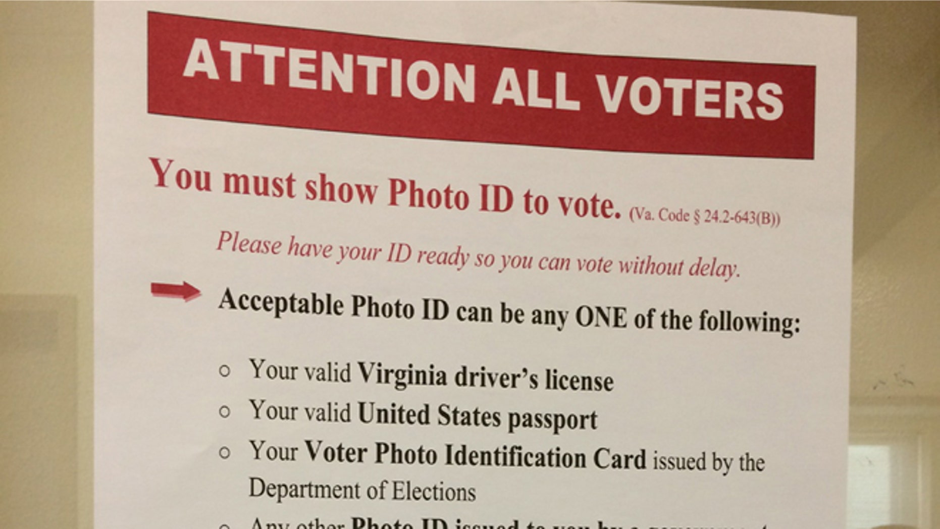 The new state rules are posted prominently at the Lee Center in Alexandria, Va., where the state began checking photo identification for registered voters on Tuesday, Nov. 4, 2014. (Julie Moos/McClatchyDC)